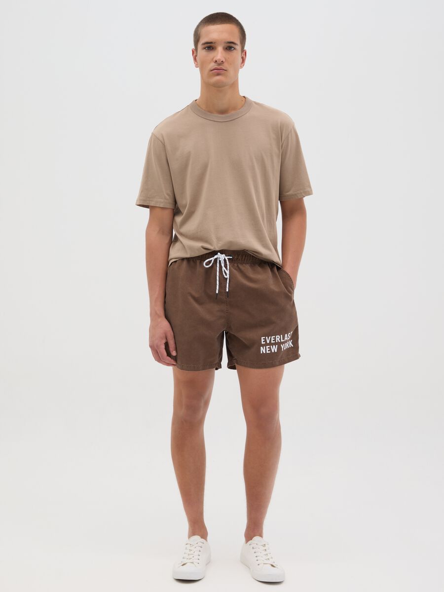 Brown swimming trunks with logo print_0