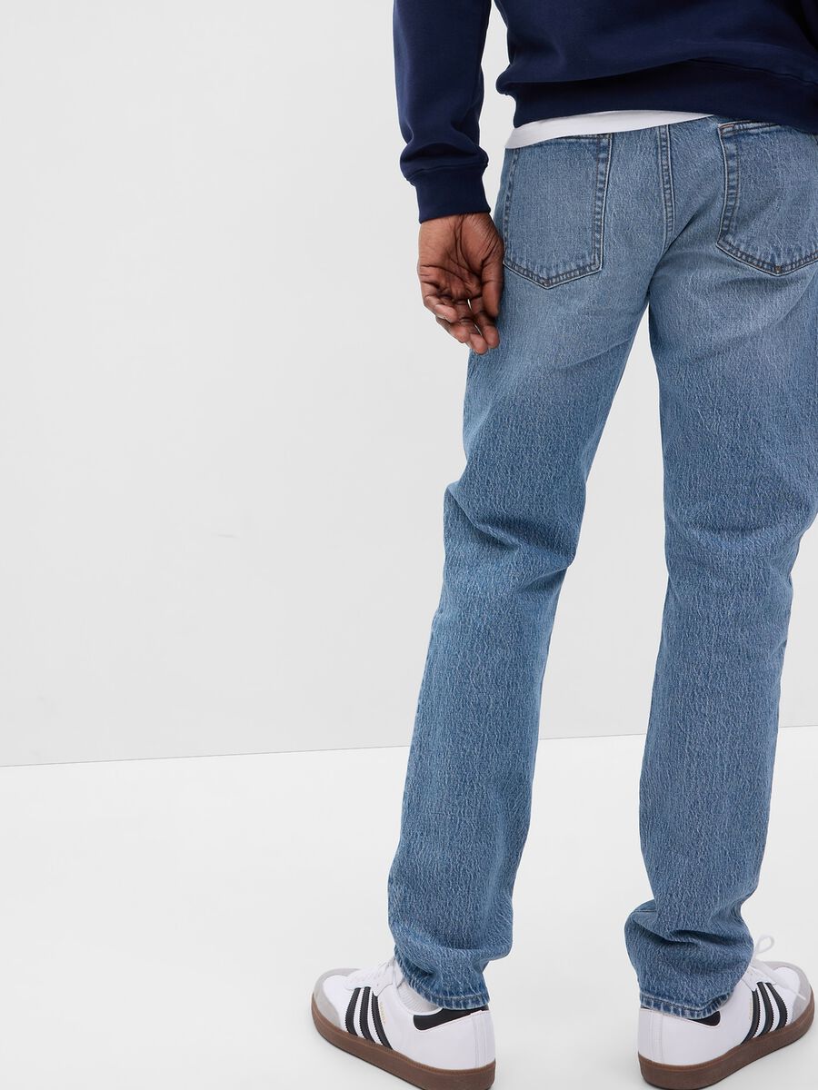 Jeans slim fit vita media con scoloriture_1