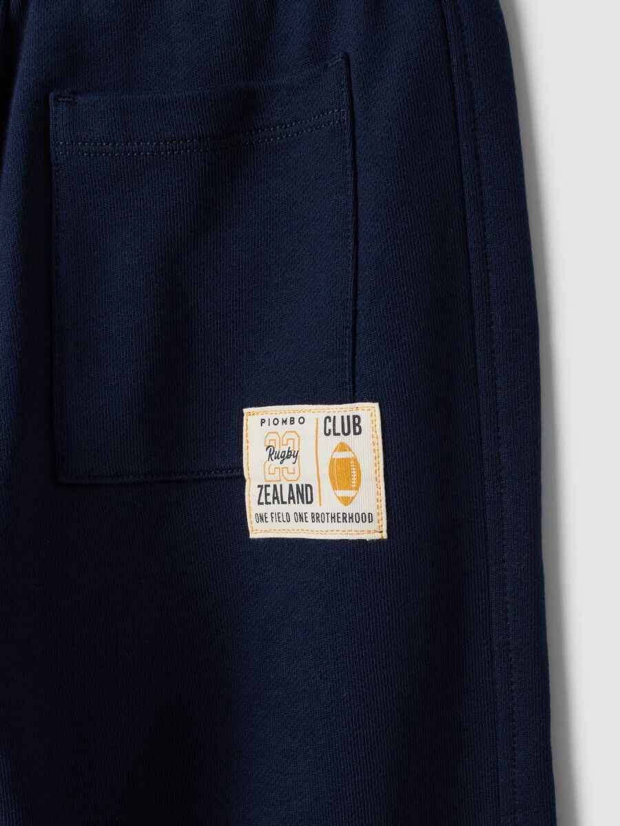 Pantaloni jogger blu in puro cotone con vita elasticizzata per bambino_3