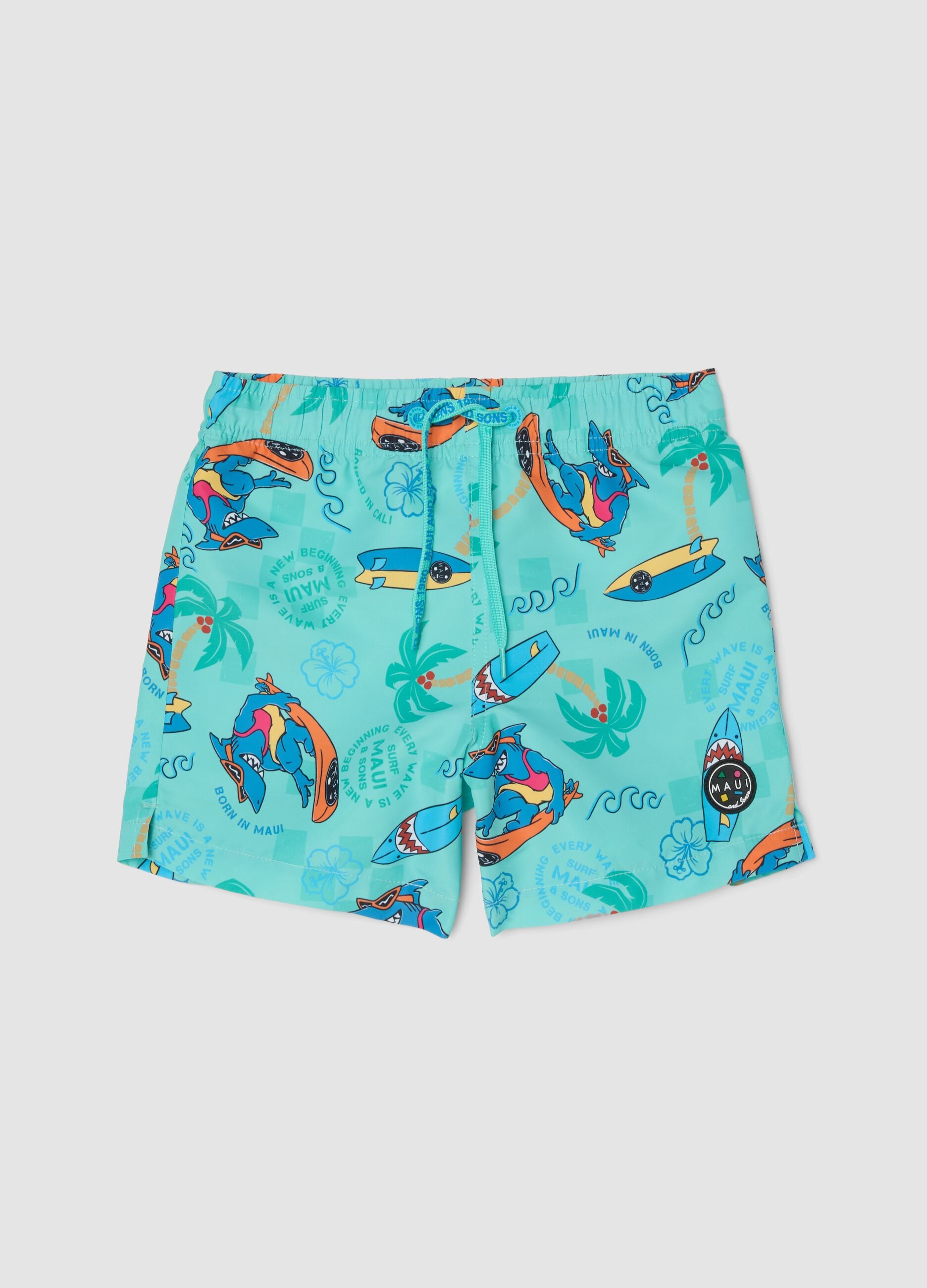 Blue boys&rsquo; swim shorts with tropical print
