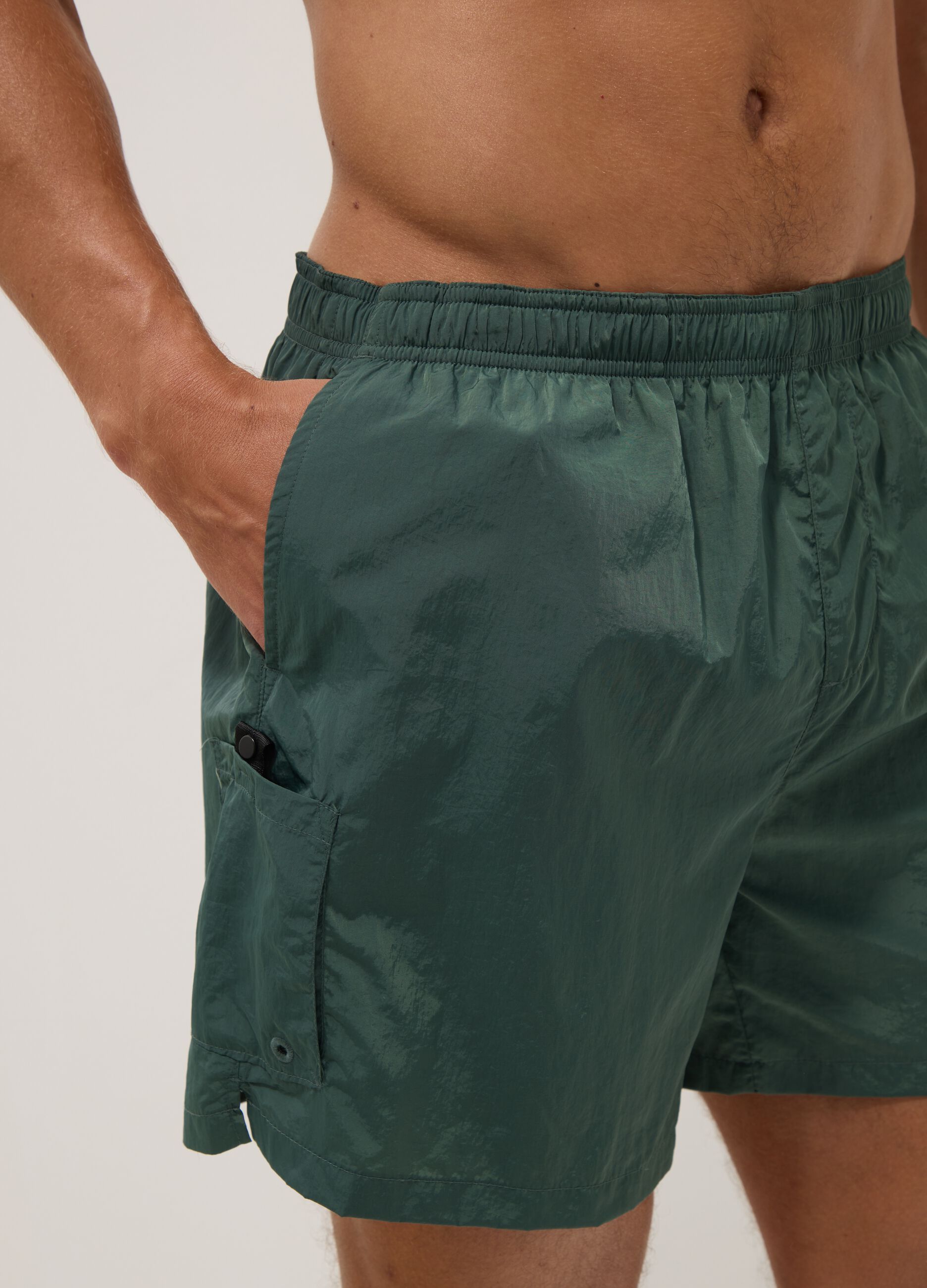 Green swim shorts with elasticated waistband