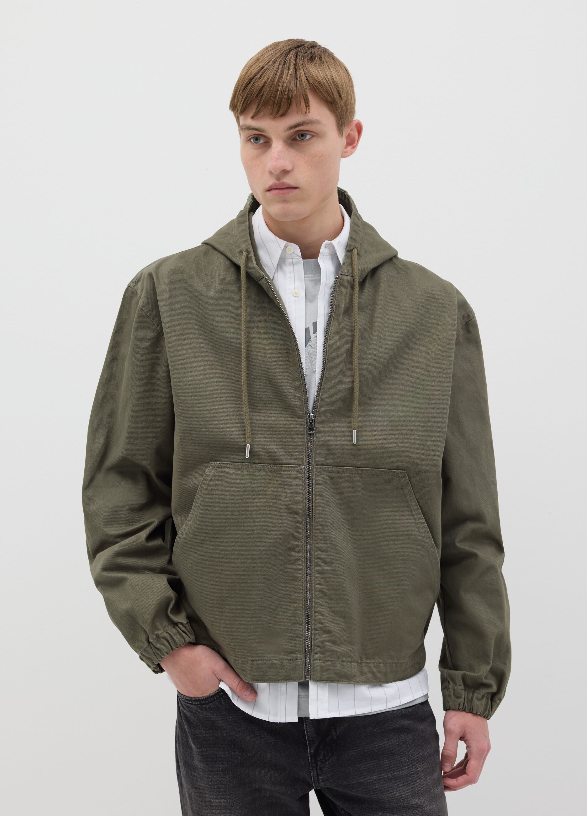 Short green full-zip jacket with hood