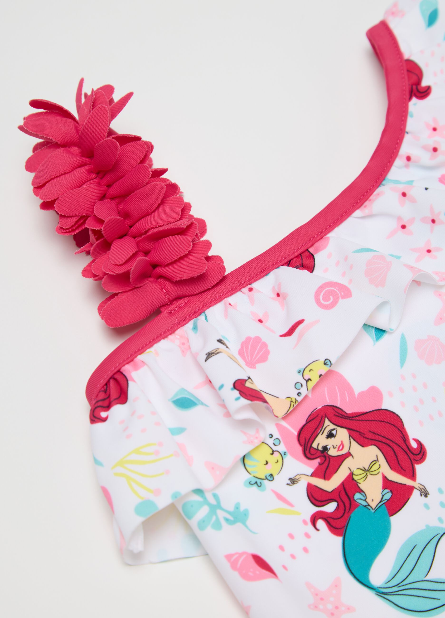 One-piece girls’ costume in a stretch blend fabric with regular fit.