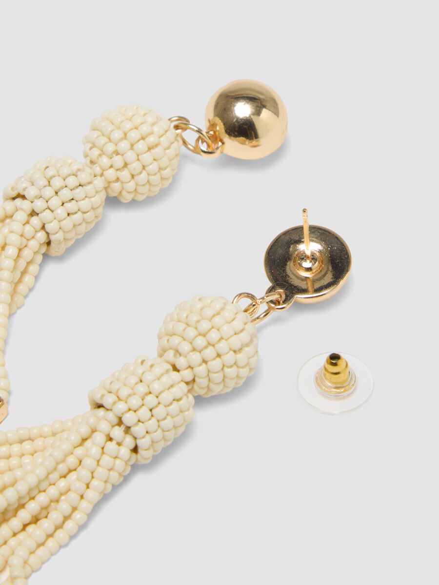 Elegant earrings with white glass beads and golden details_2