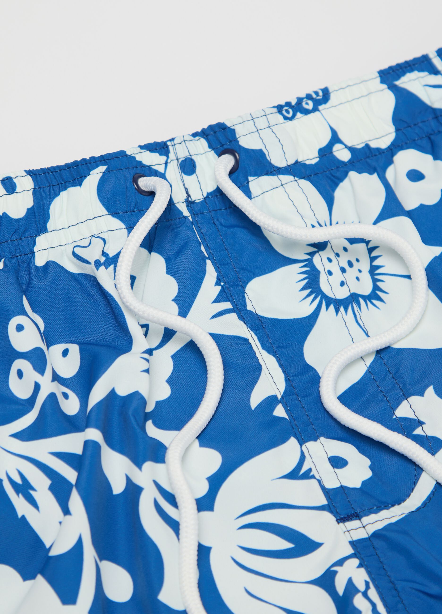 Blue floral print swimming trunks