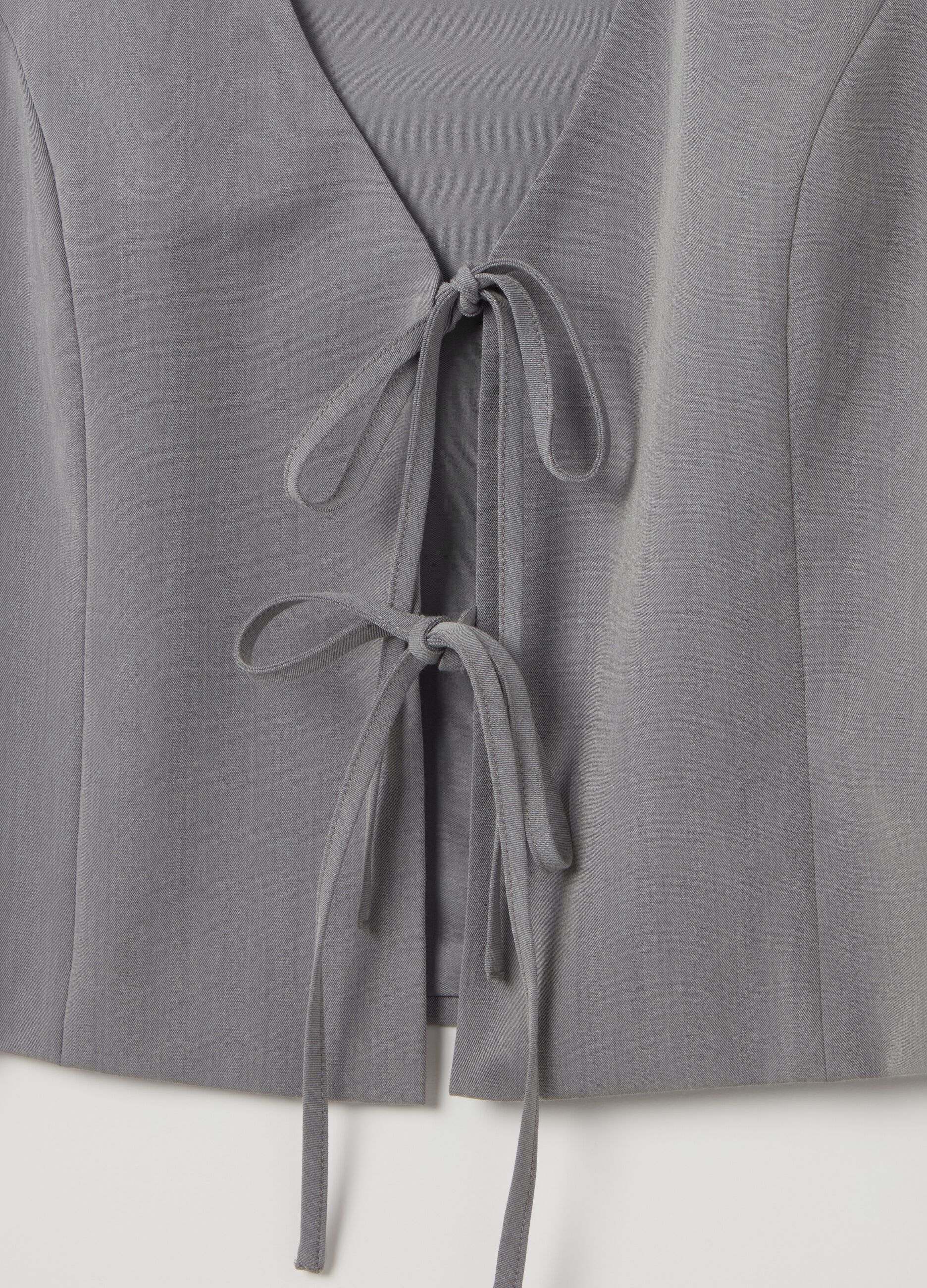 Gilet con laccetti