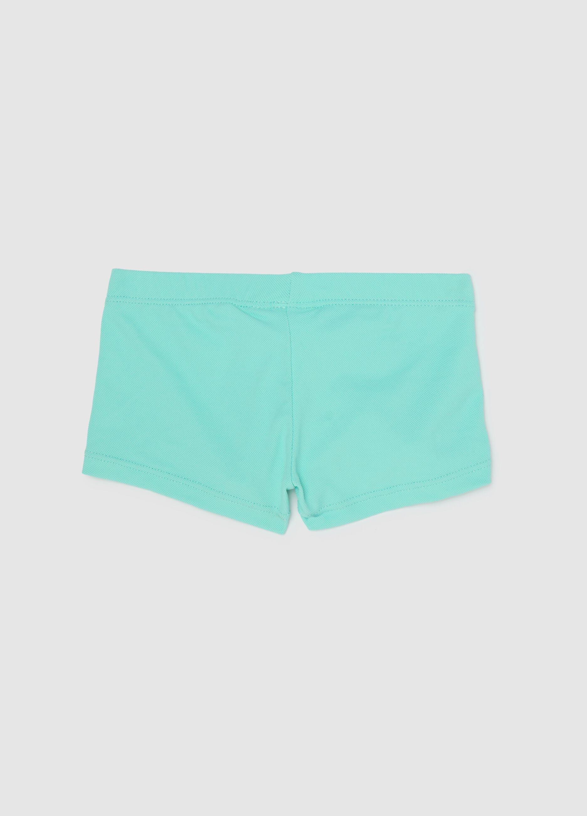 Boys’ swimsuit in light blue stretch fabric with print