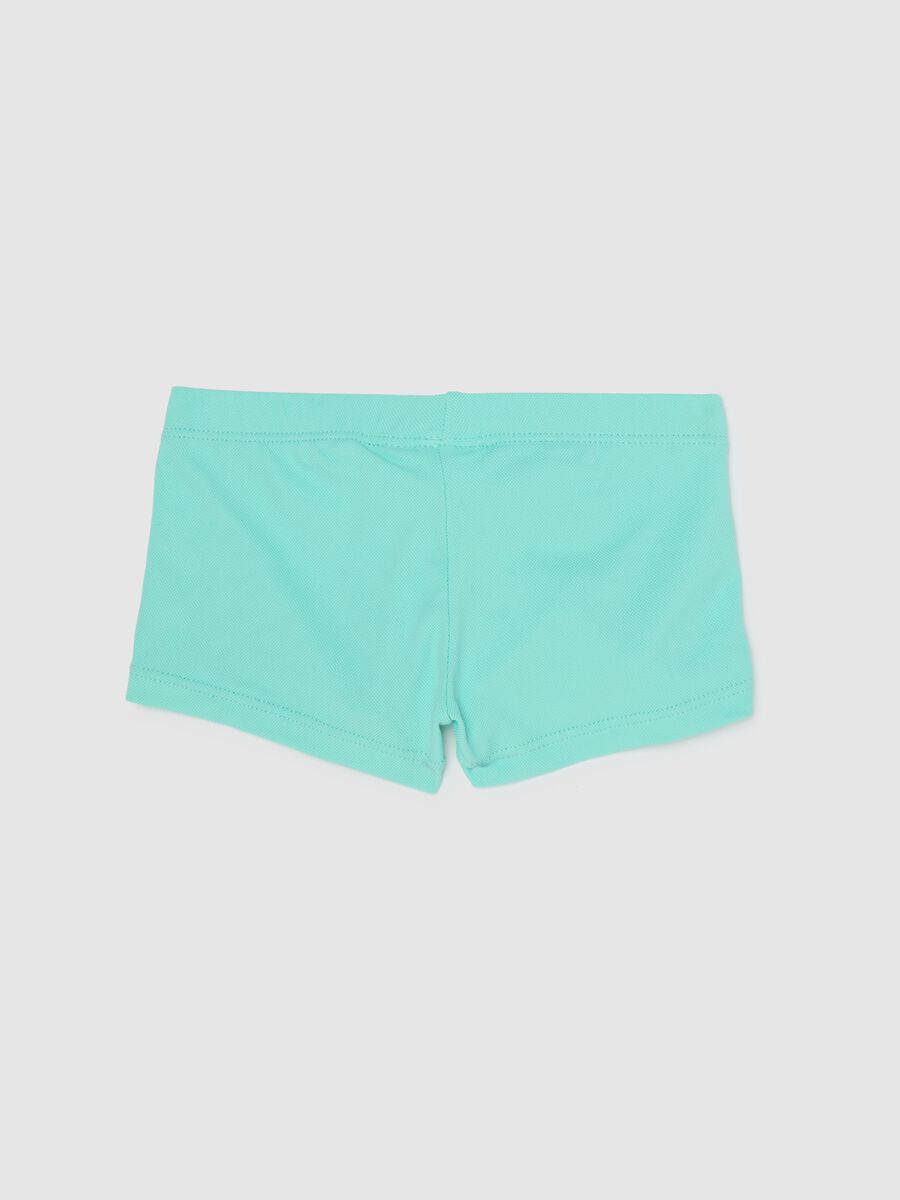 Boys’ swimsuit in light blue stretch fabric with print_1
