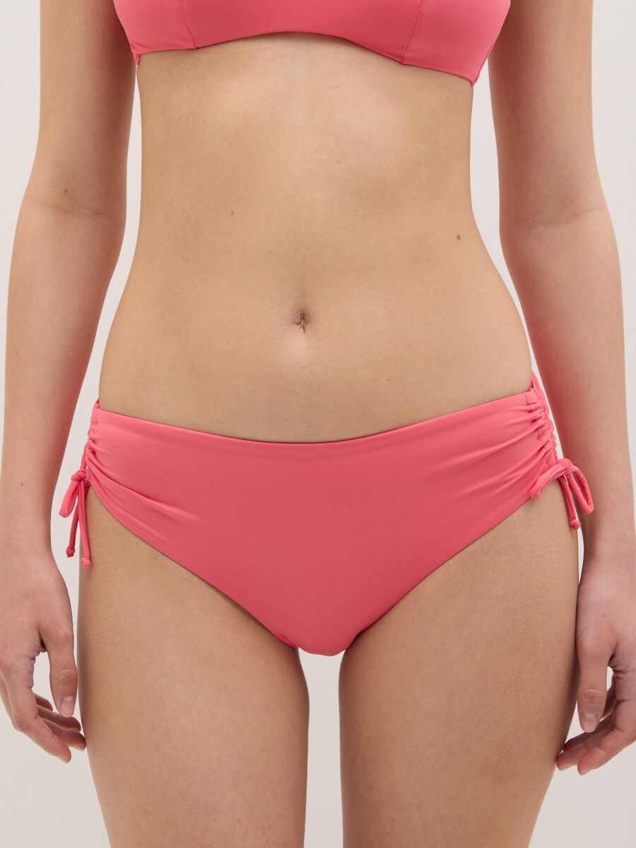 Women’s bikini briefs in pink stretch blend with gathered sides._1