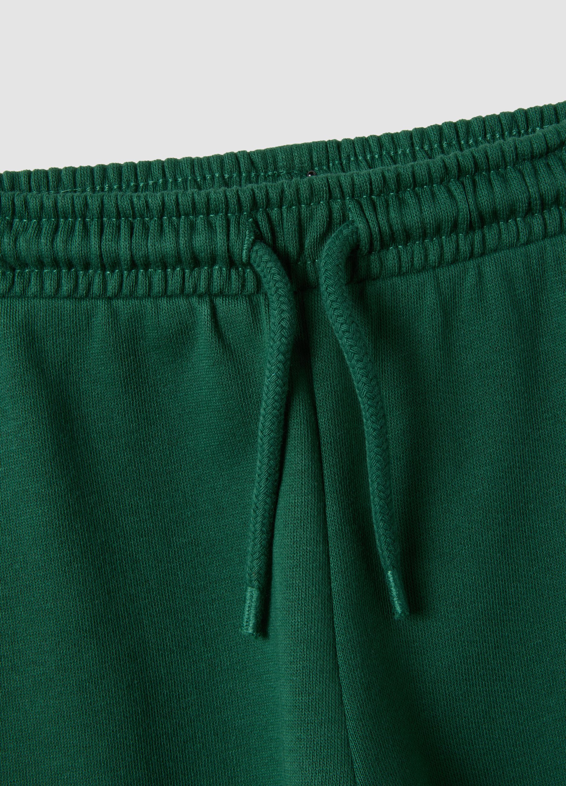 Pantaloni jogger verdi in puro cotone organico con coulisse per bimbo