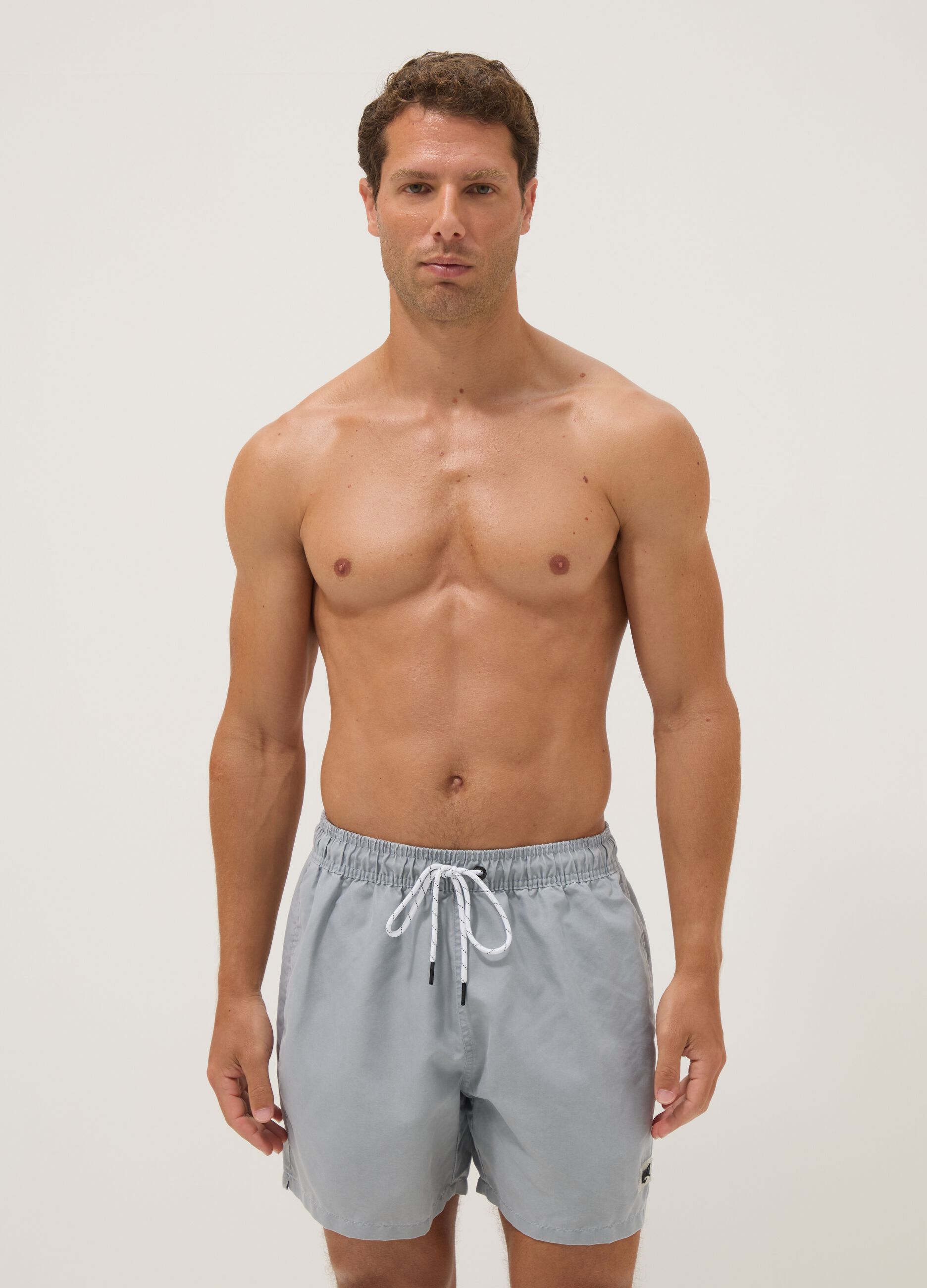 Blue swim shorts with drawstring waist