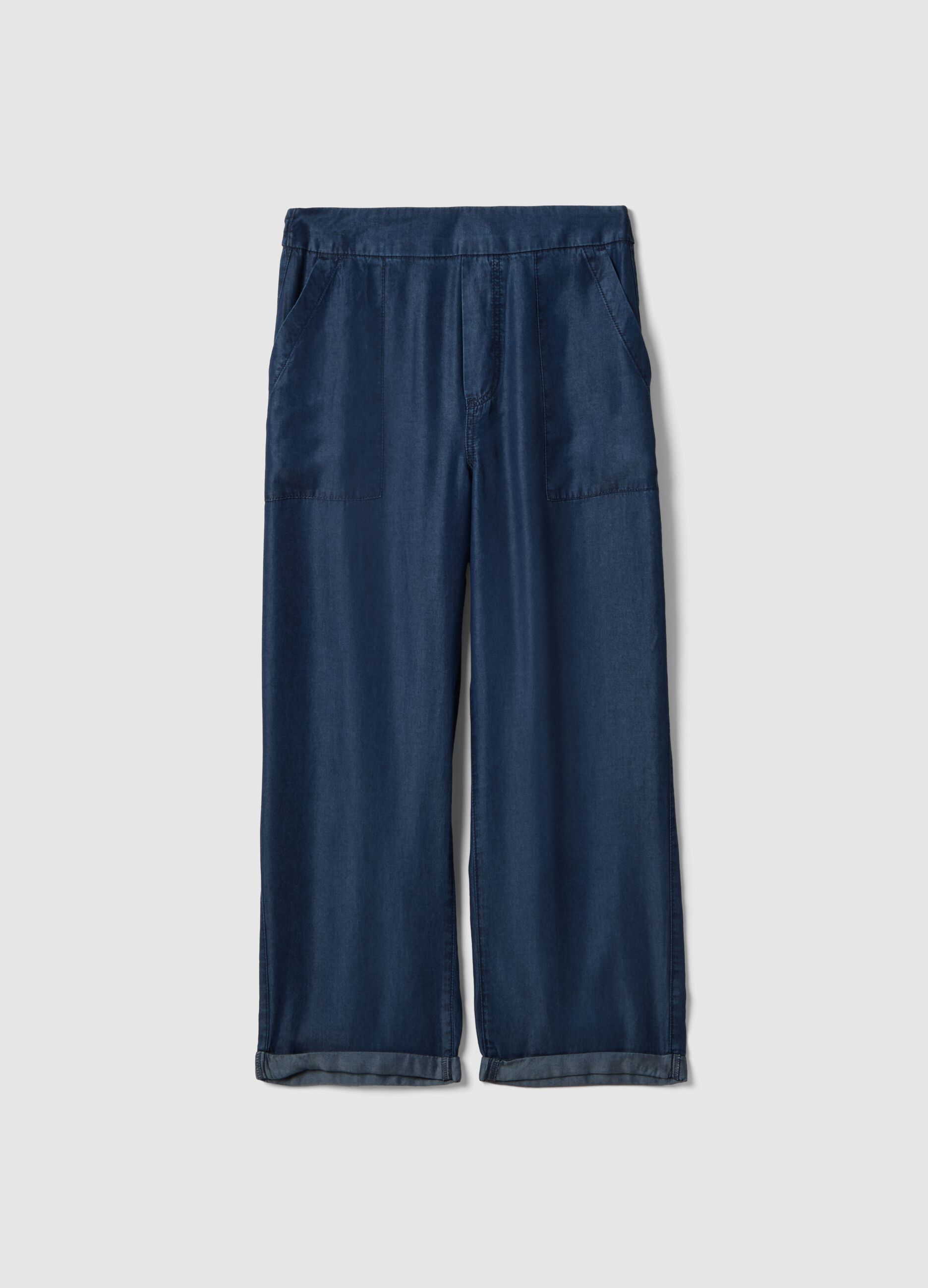 Blue denim jeans in 100% lyocell with elasticated waist, relaxed fit