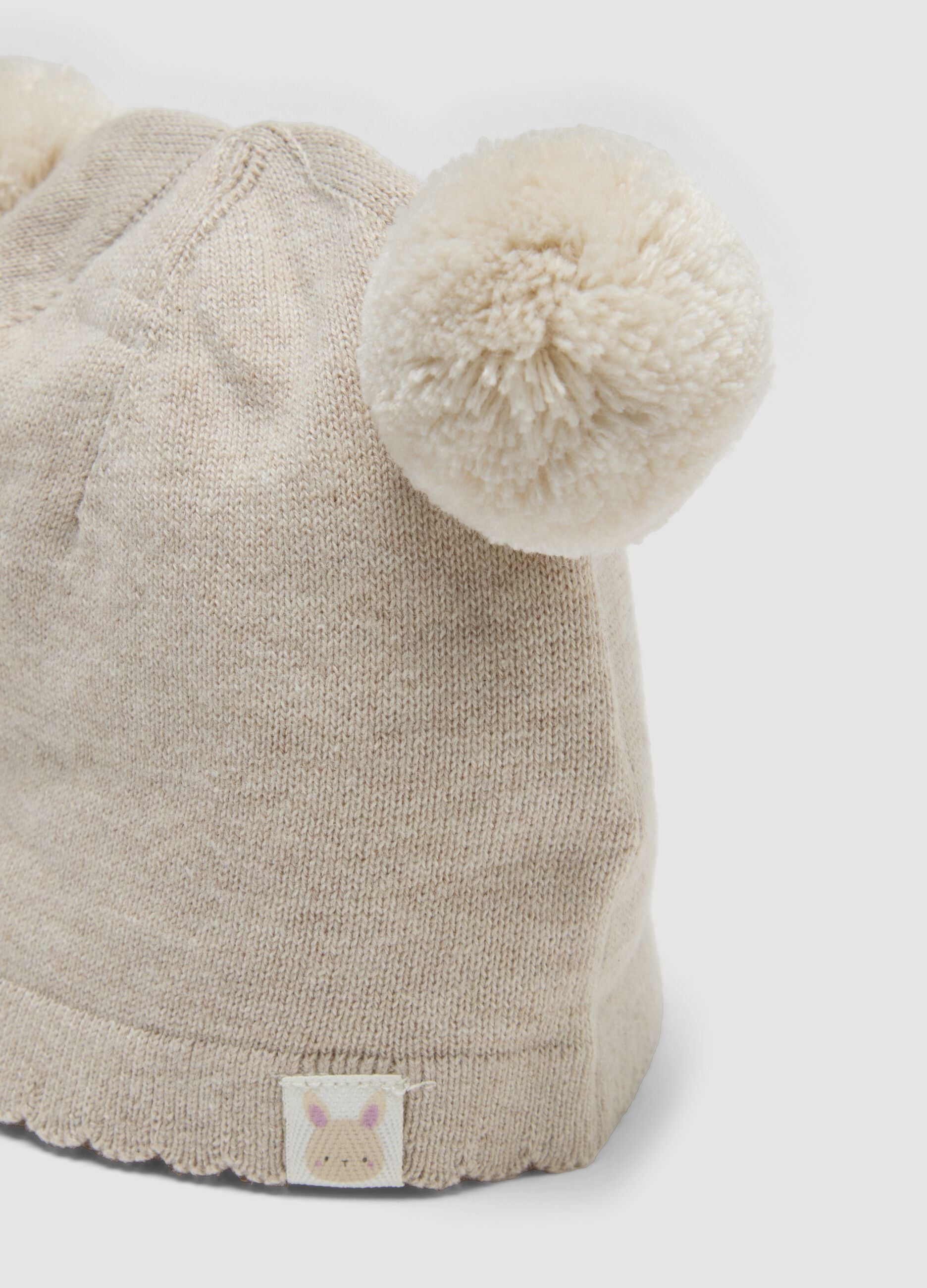 Beige knitted hat in pure organic cotton with pom-poms for baby girl