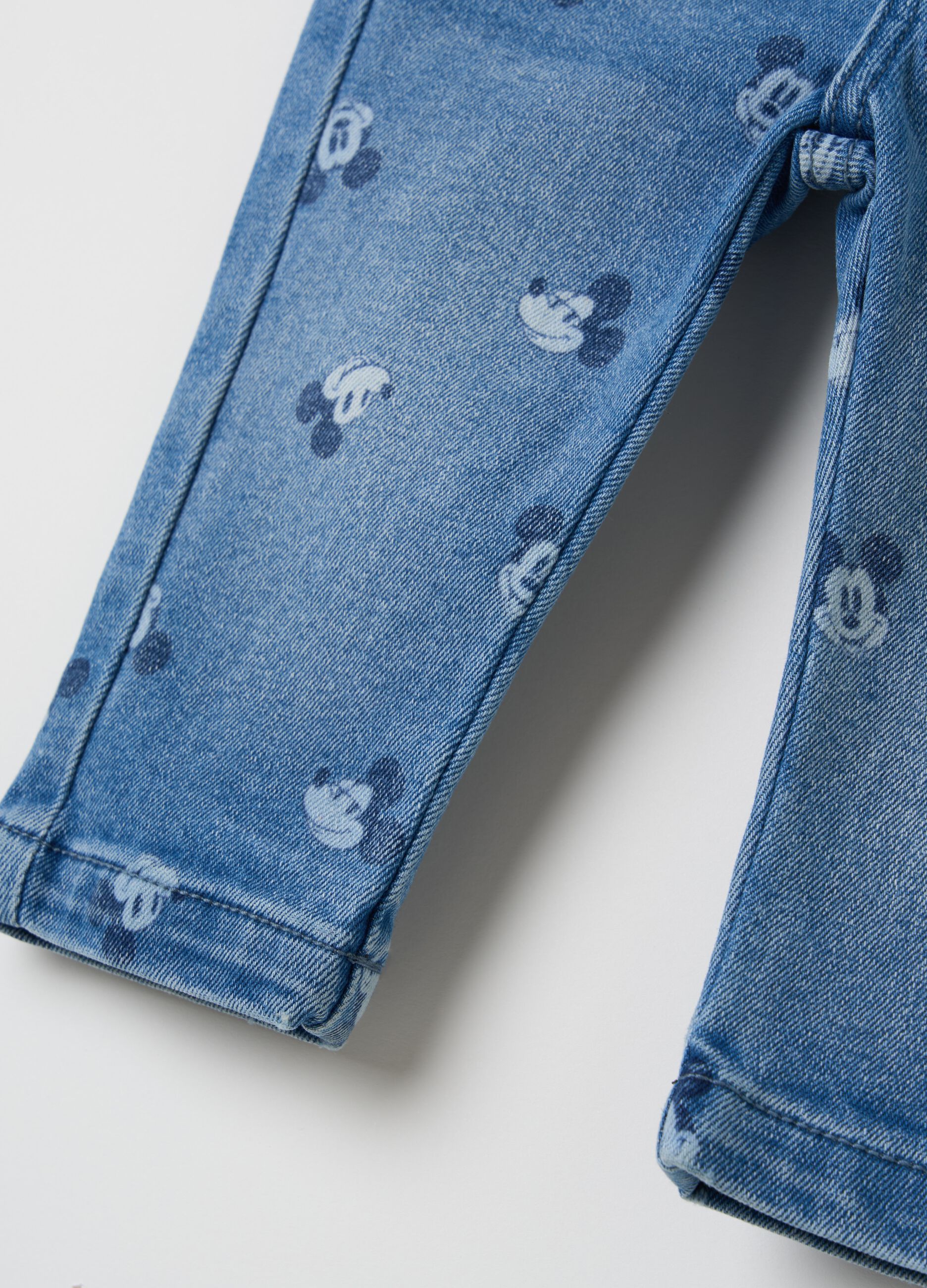 Jeans with all-over Mickey Mouse print