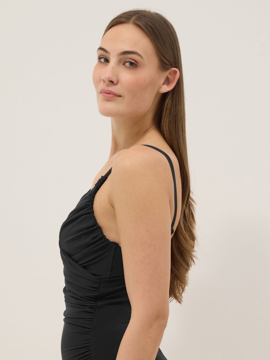 Black draped stretch swimsuit with shaping effect_3