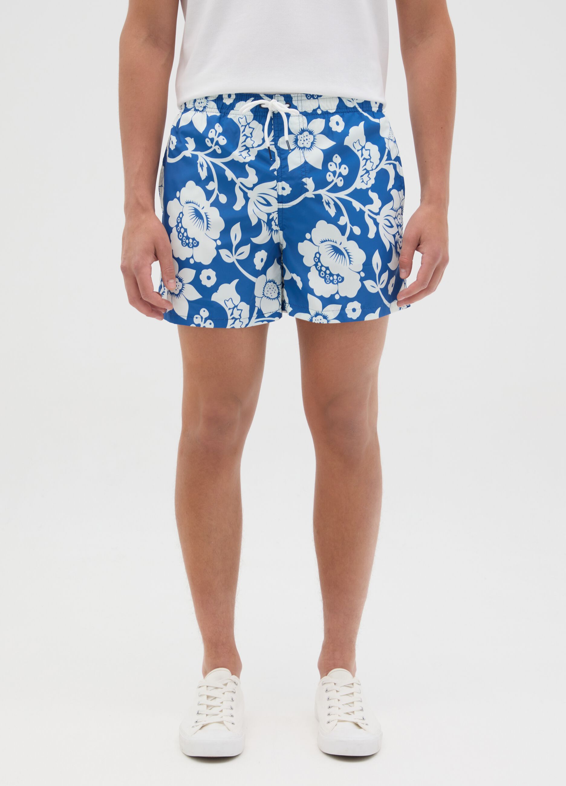 Blue floral print swimming trunks