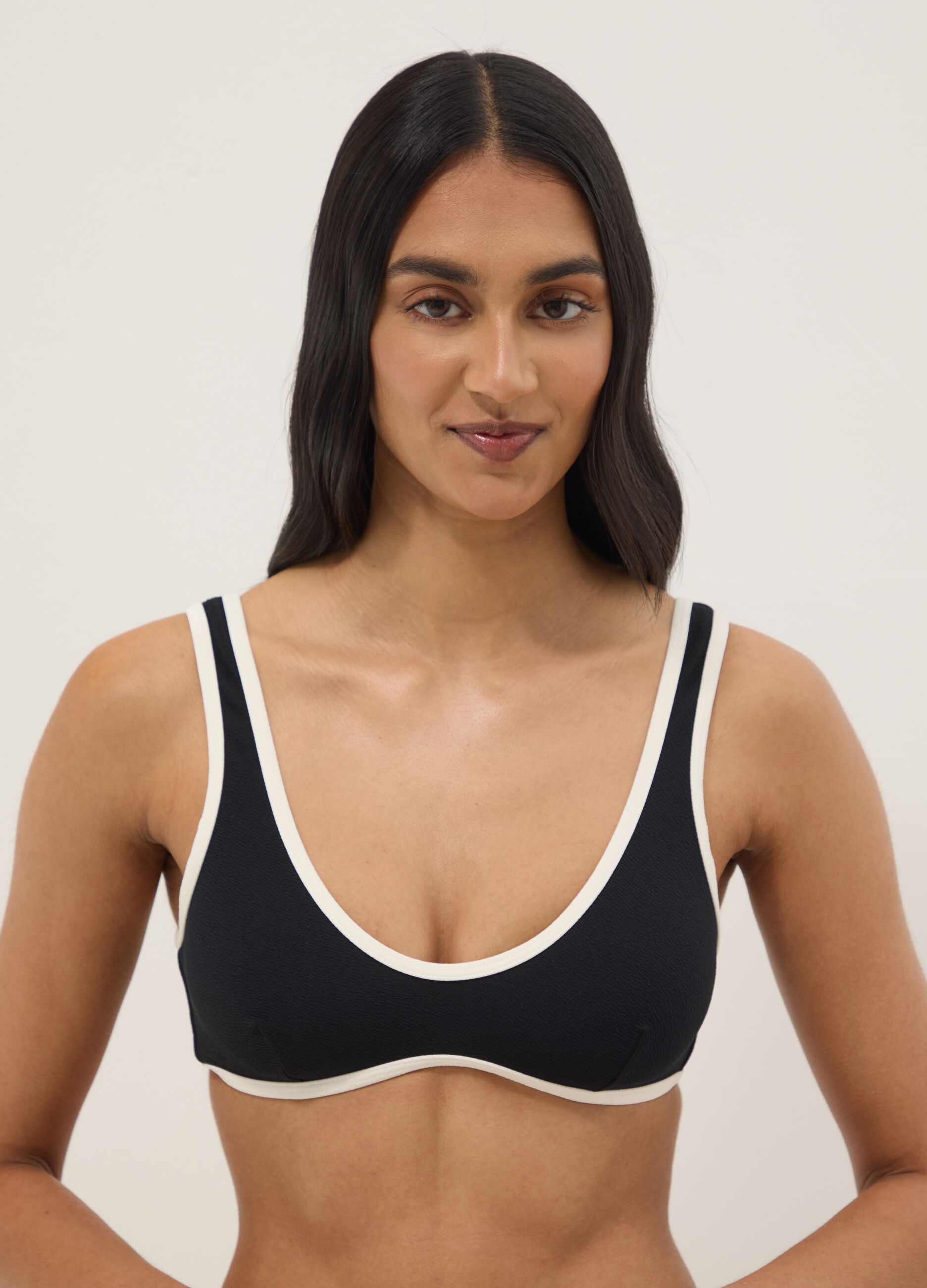 Black stretch fabric bikini top with white trim