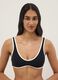Black stretch fabric bikini top with white trim_0