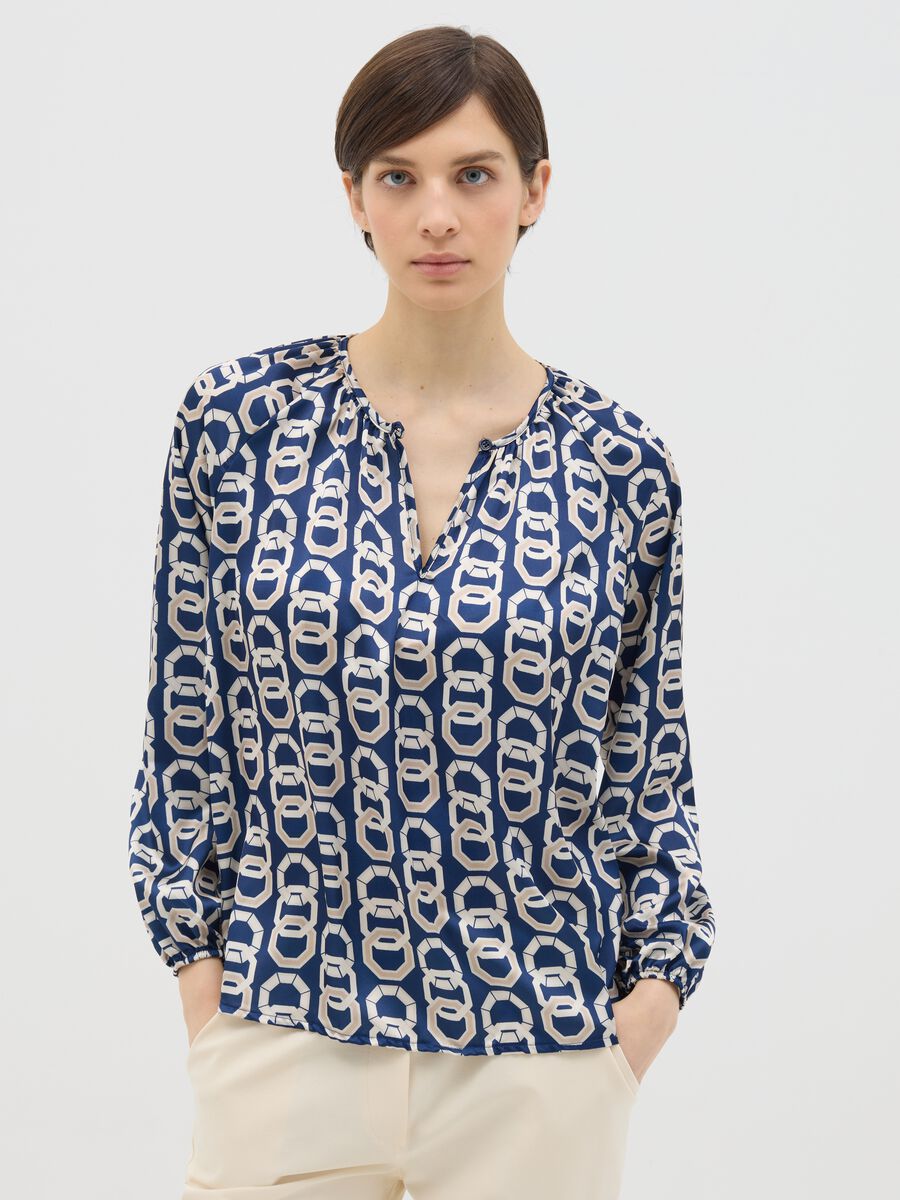 Blusa blu a maniche lunghe con stampa geometrica _0