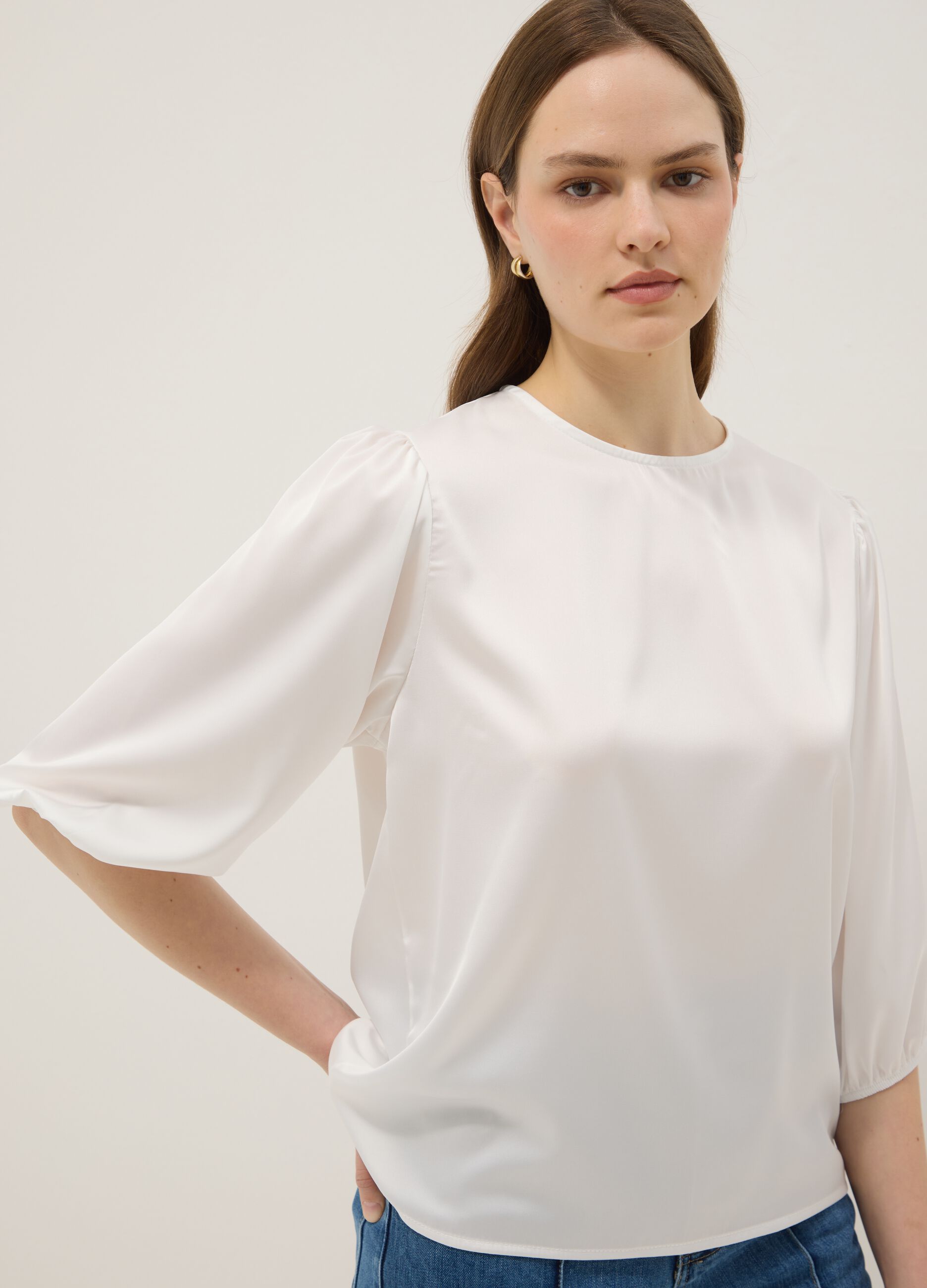 White long-sleeve top with wide sleeves