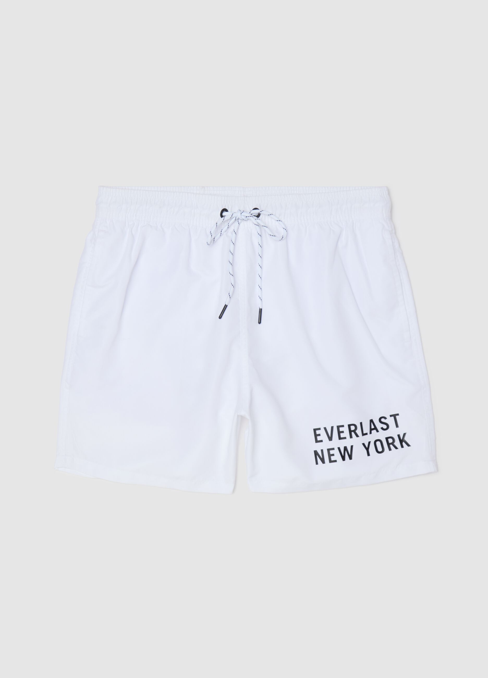 White swimming trunks with logo print
