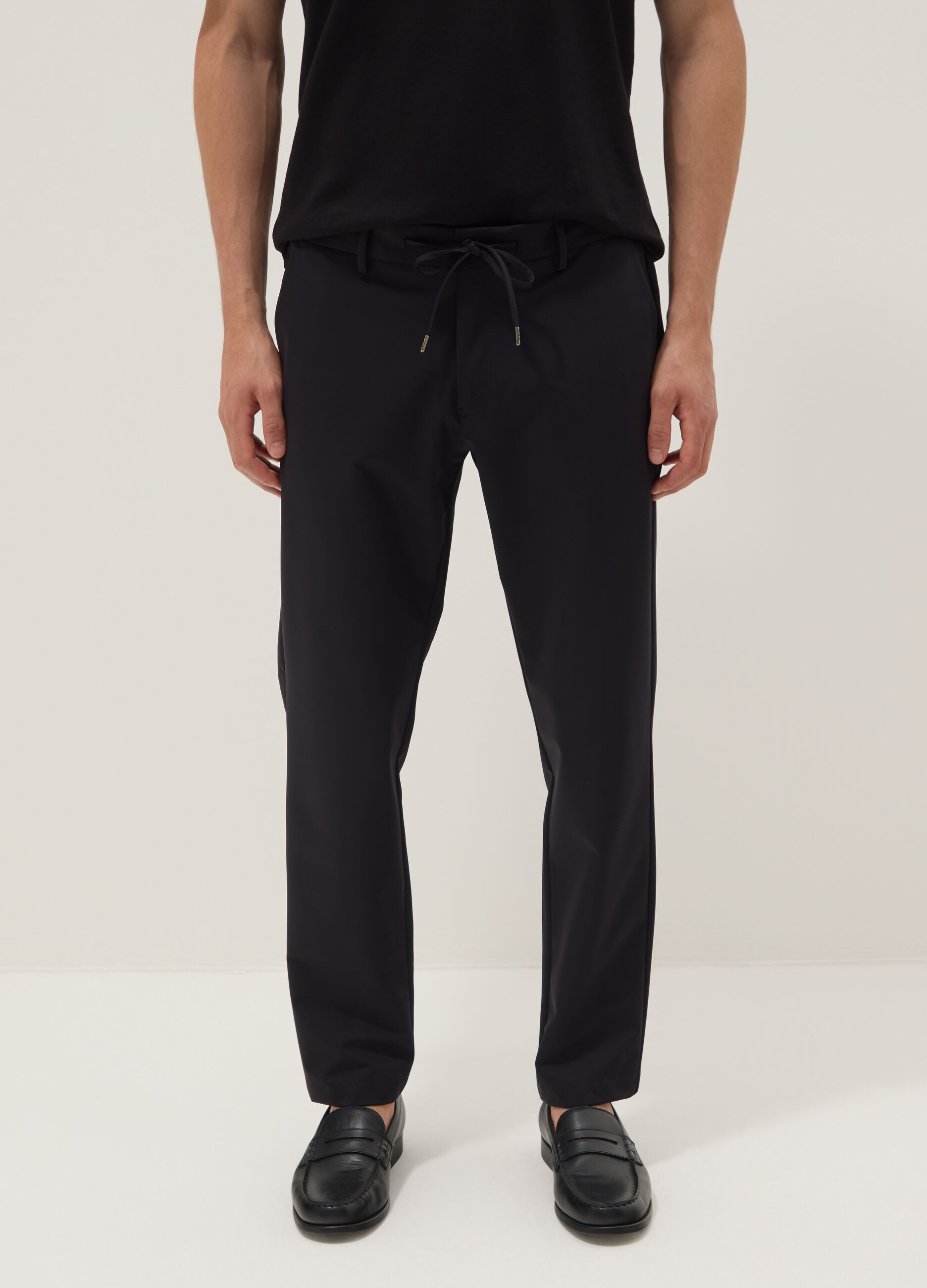 Black stretch carrot-fit chino trousers