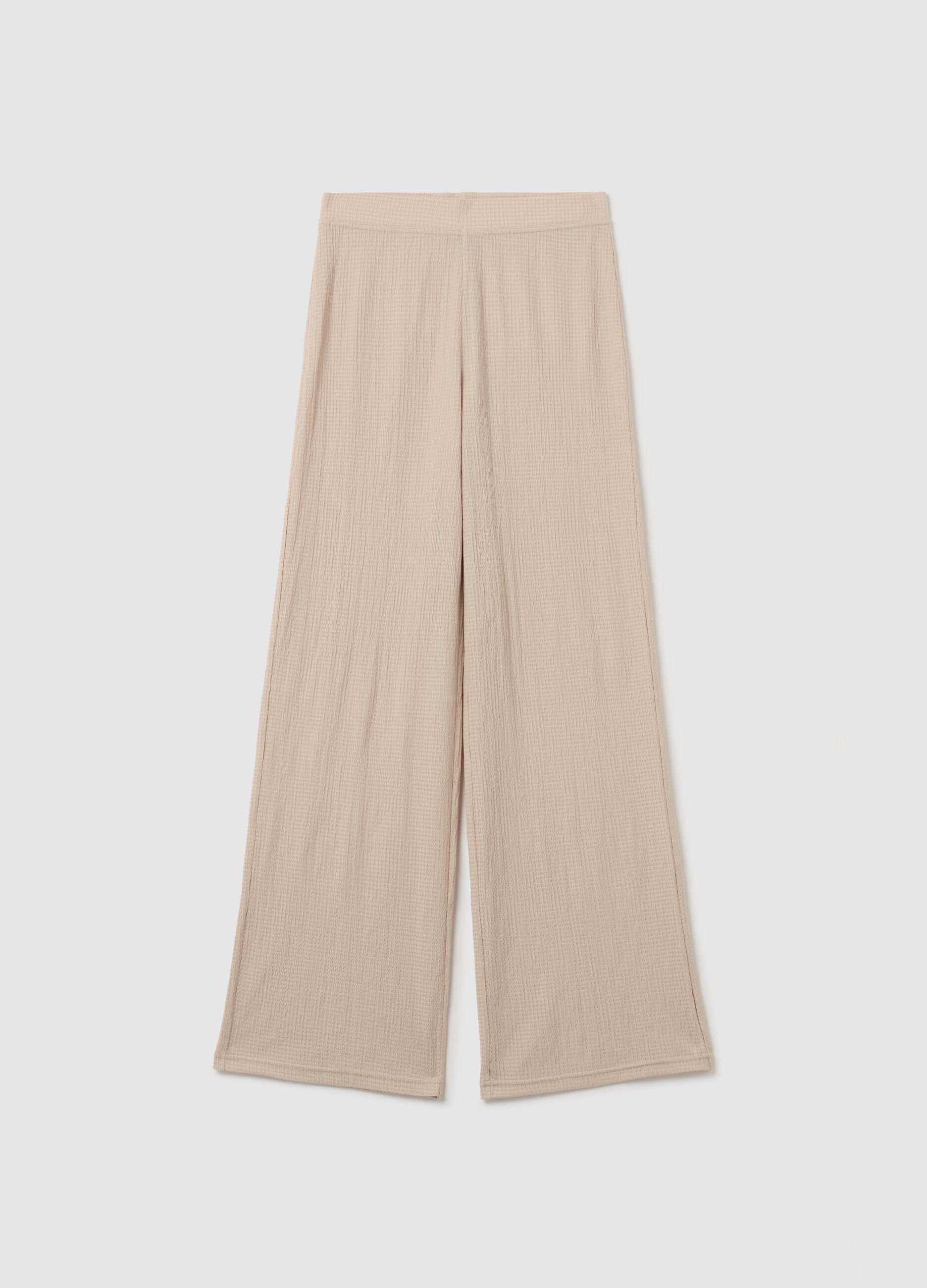 Pantalone a gamba larga beige con trama waffle