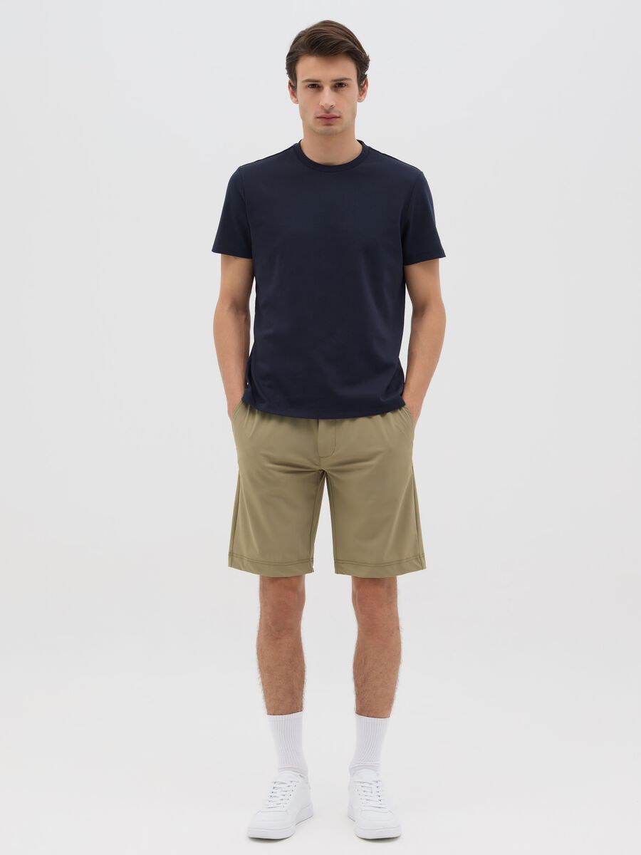Green shorts with button and zip closure_0