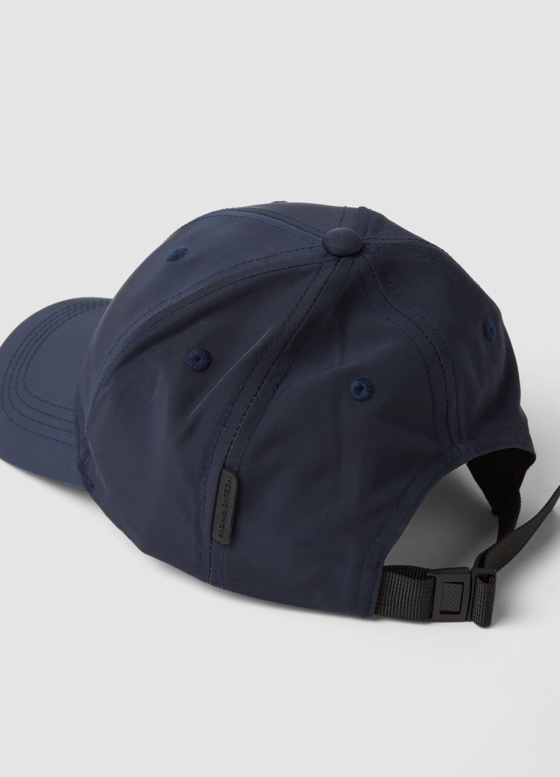Blue cap with curved peak