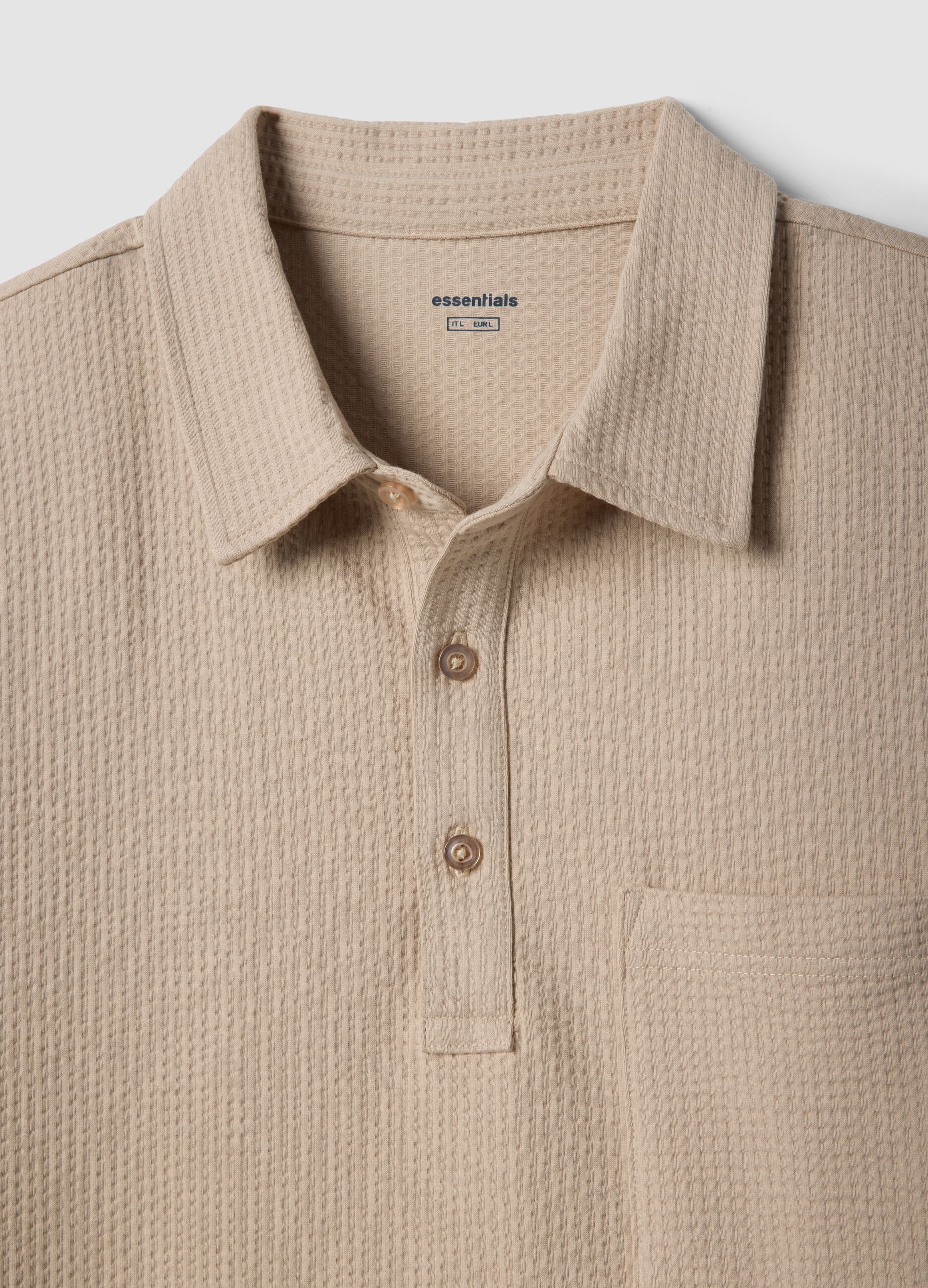 Polo beige a maniche corte in tessuto elasticizzato