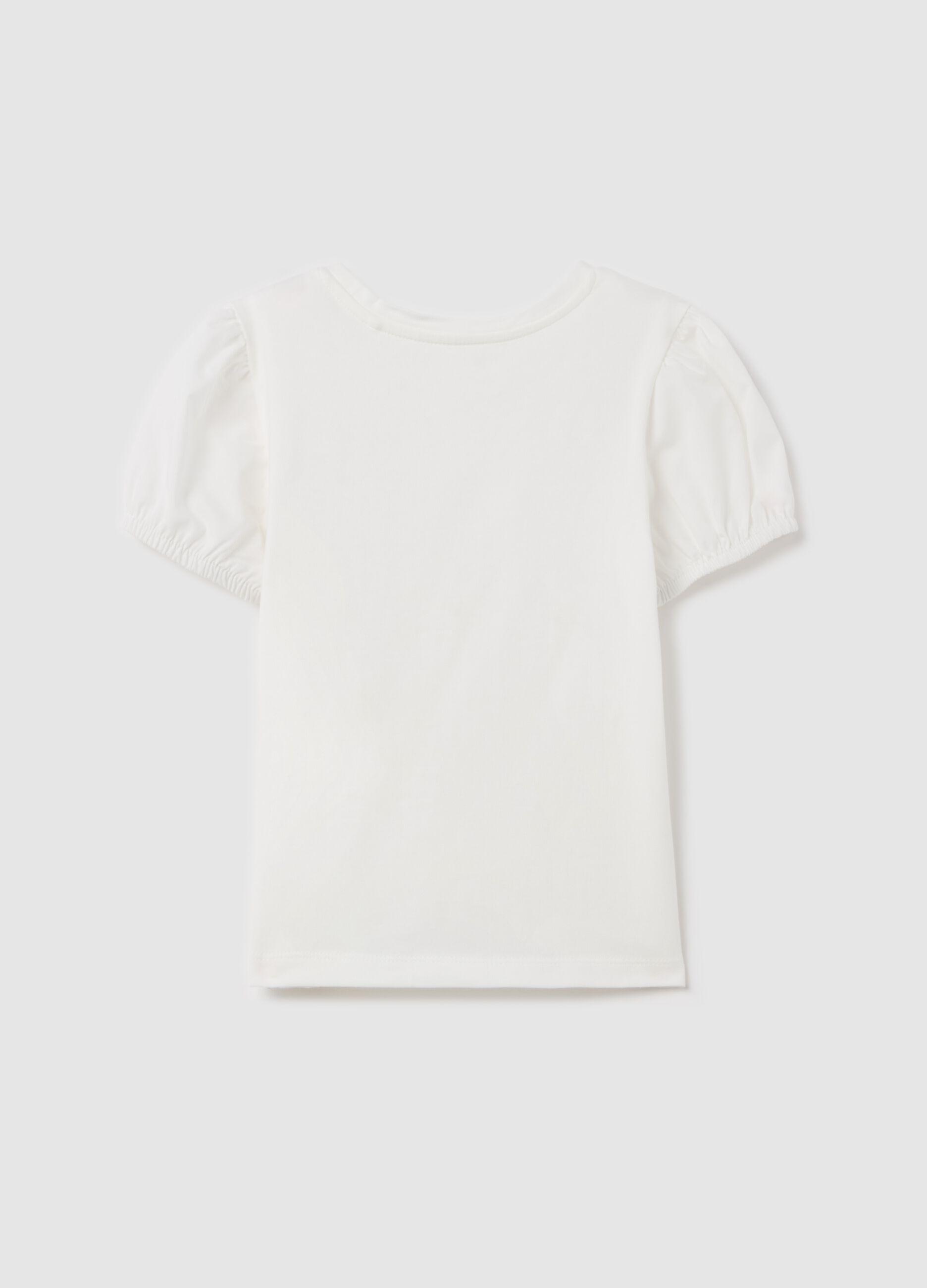 T-shirt with flowers application and pompoms