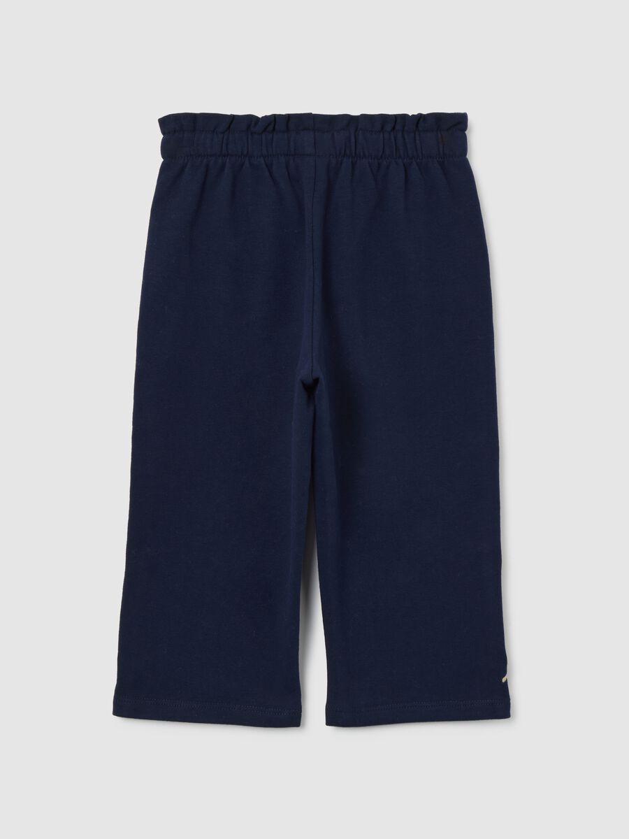 Pantaloni corti blu da bimba in cotone elasticizzato con fiocchetti_1