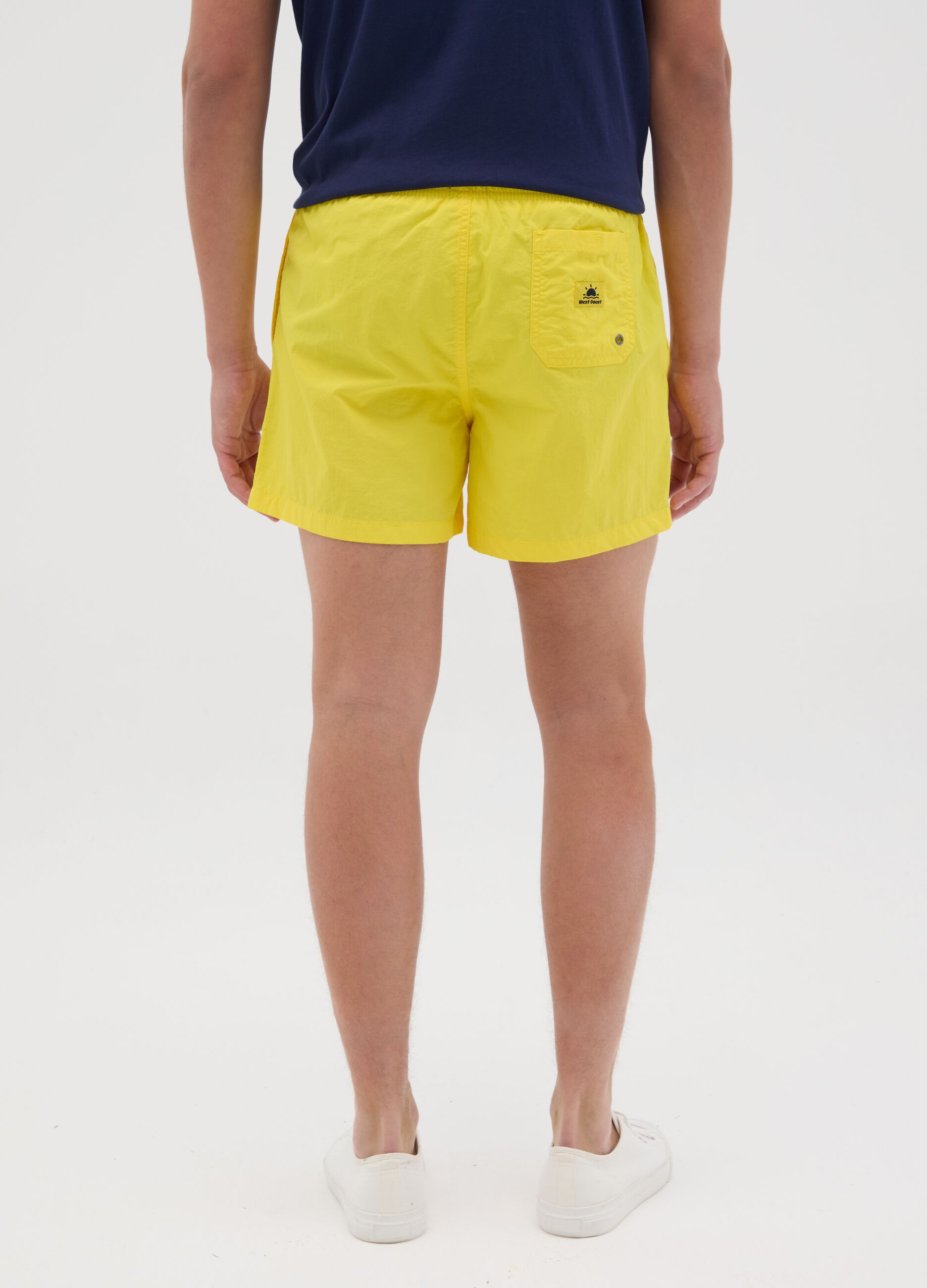 Men’s regular-fit swim boxers in yellow blend fabric with elastic waist