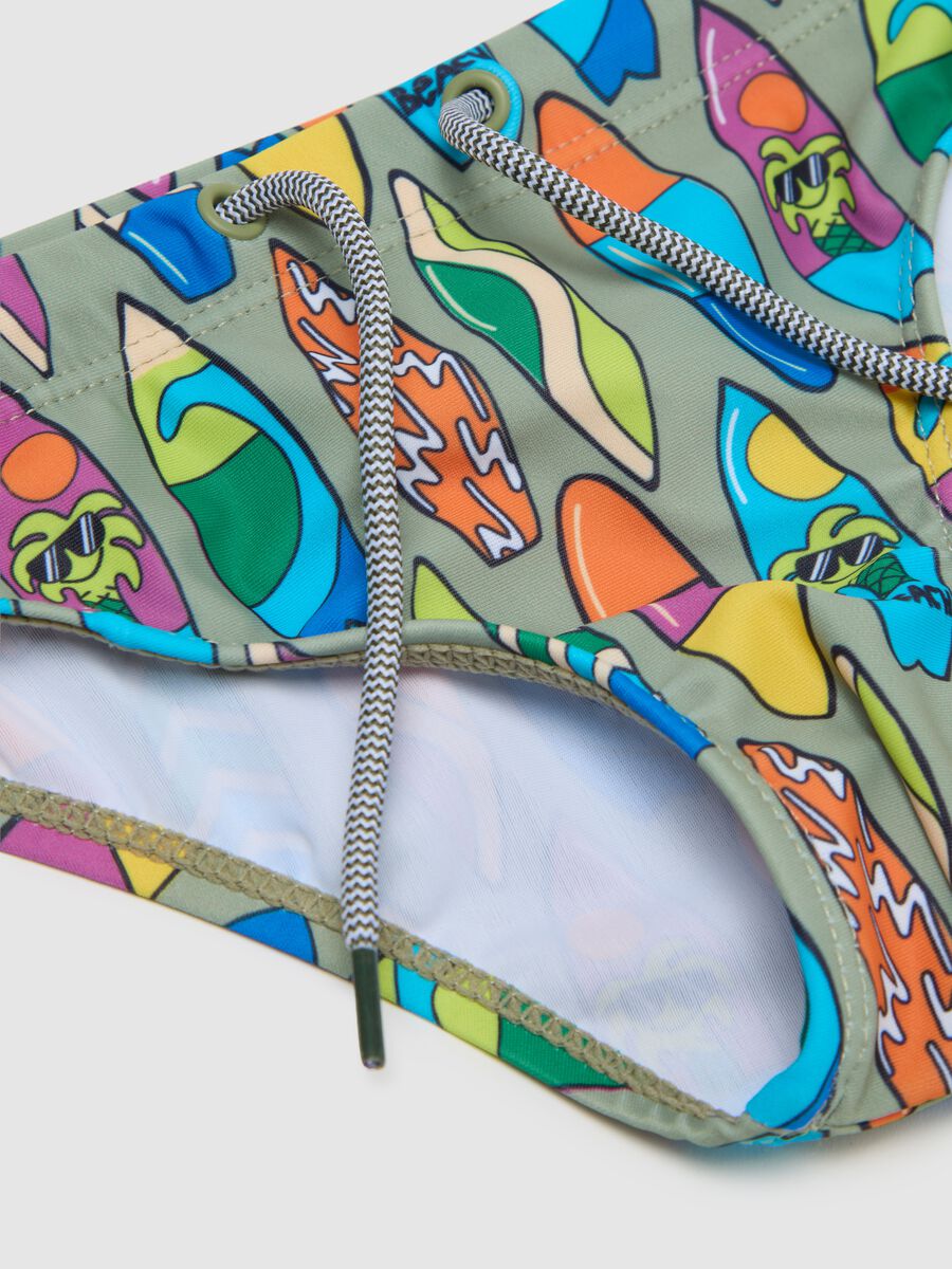 Boys’ swim briefs in multicoloured stretch fabric and with elastic waistband_2
