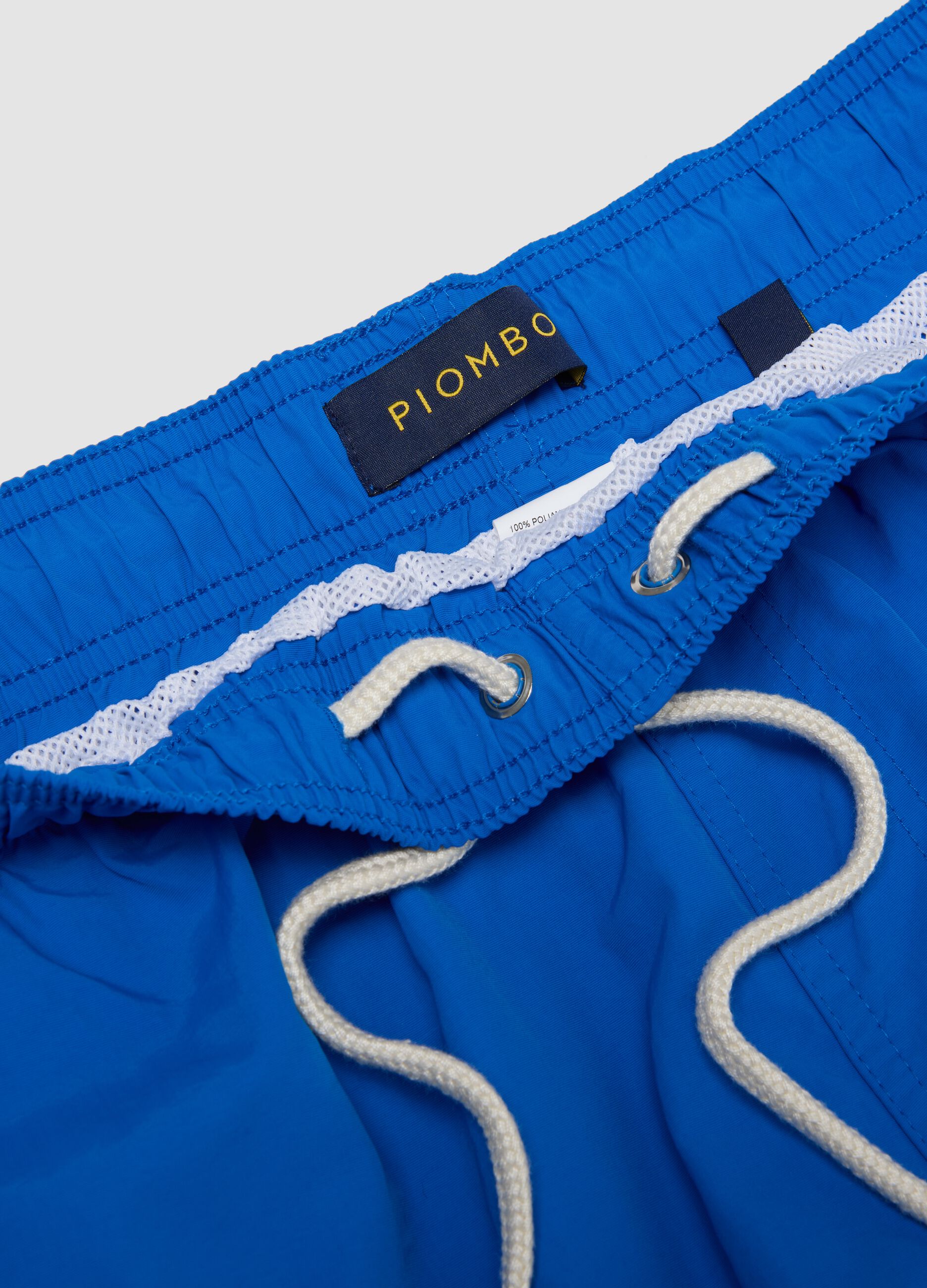 Blue swim shorts with elasticated waist and drawstring