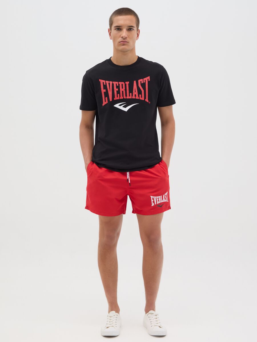 Red swimming trunks with logo print_0