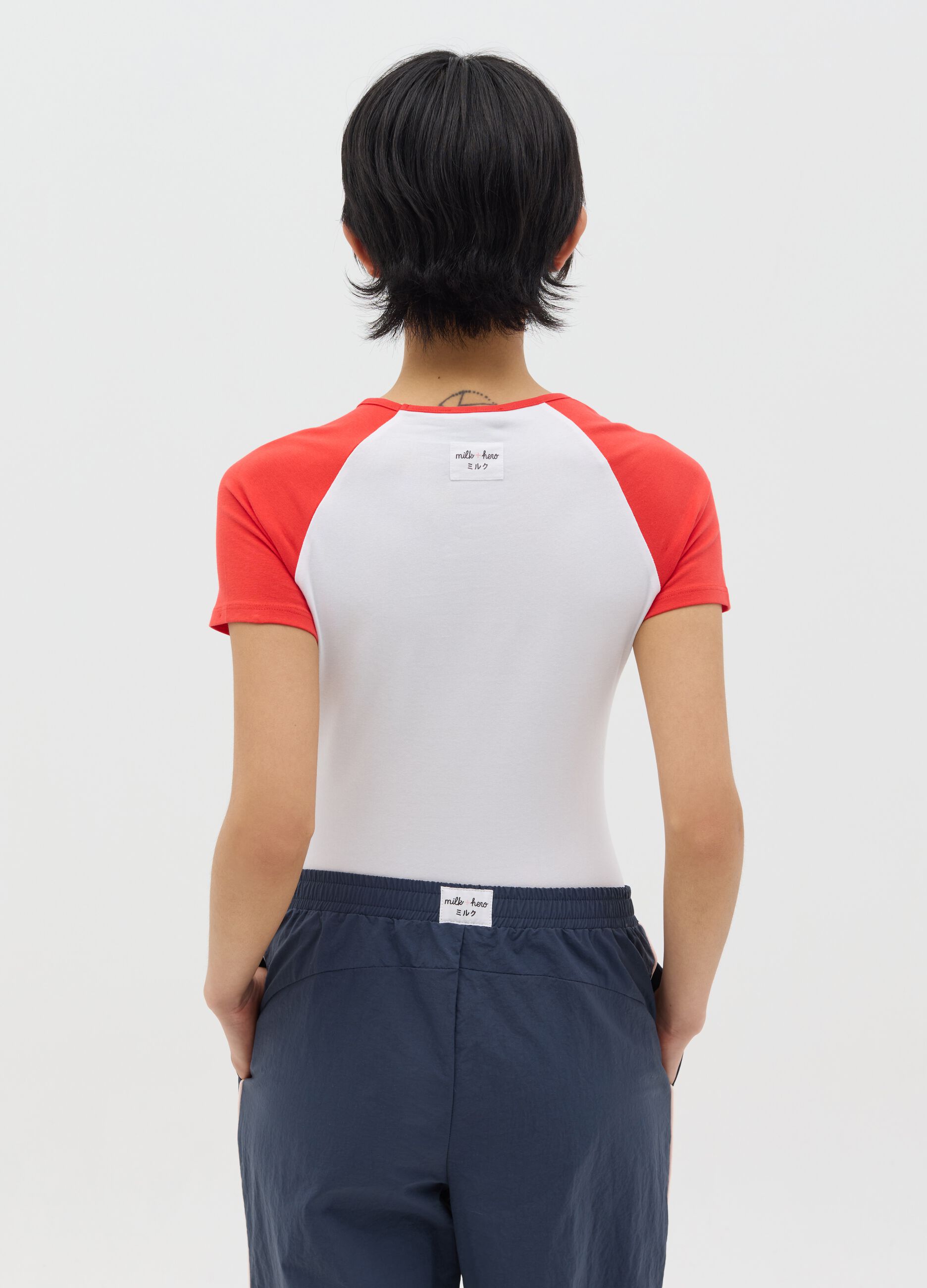 White bodysuit with short black sleeves
