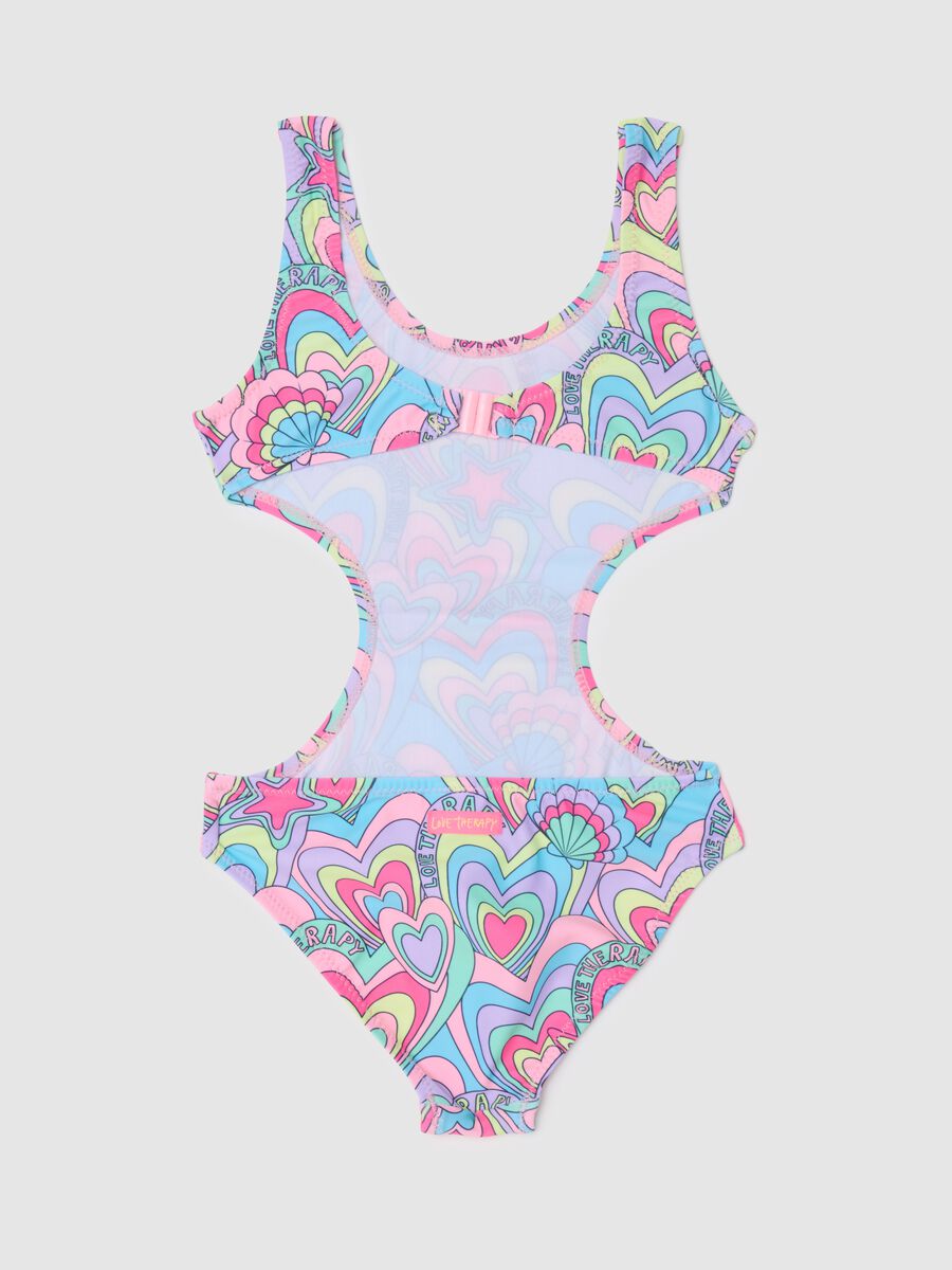 Girl's one-piece swimsuit in multicoloured stretch fabric with cut-outs_1