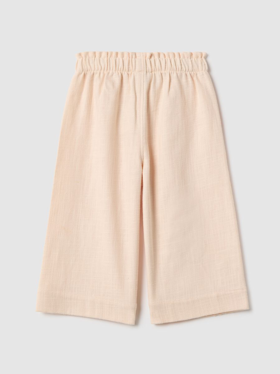 Beige culotte trousers in cotton and linen for girls with floral embroidery_1