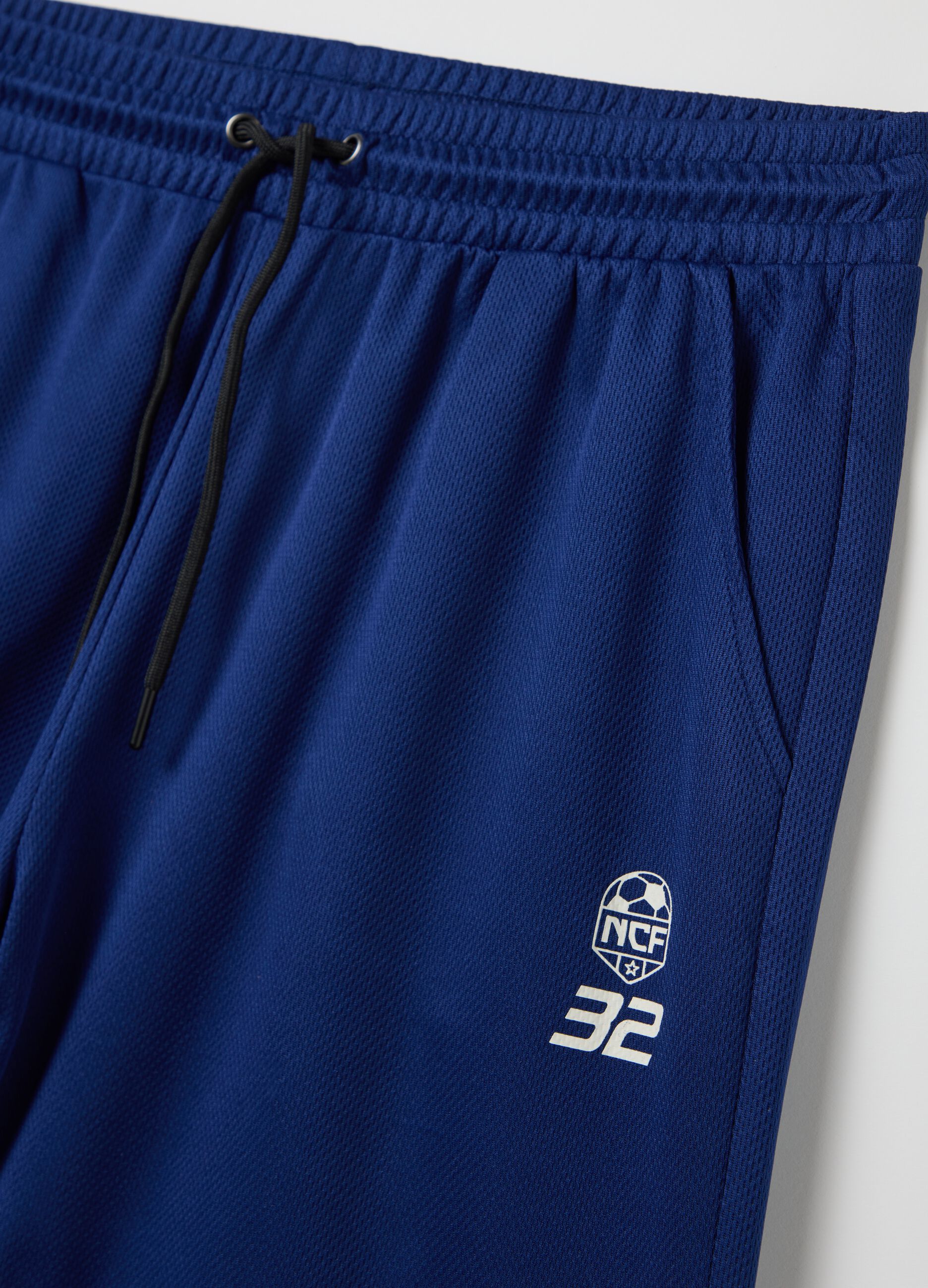 Blue Bermuda joggers with NFC print
