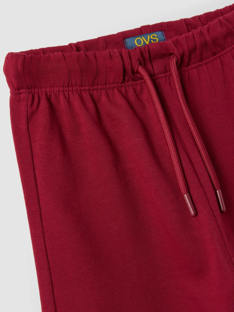 Pantaloni rossi in puro cotone con vita elasticizzata e fiocco per bambina_3