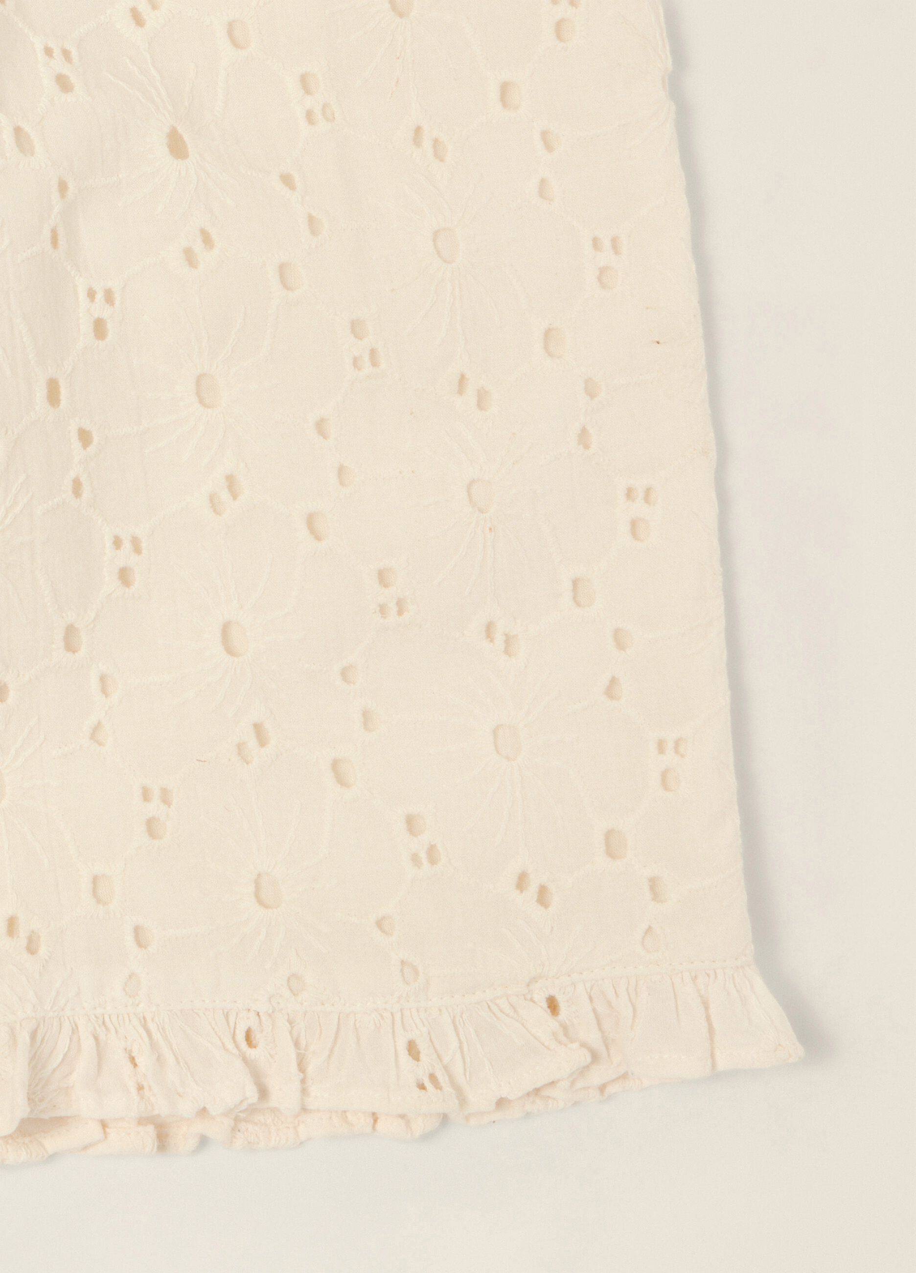 White broderie cotton trousers for baby girls