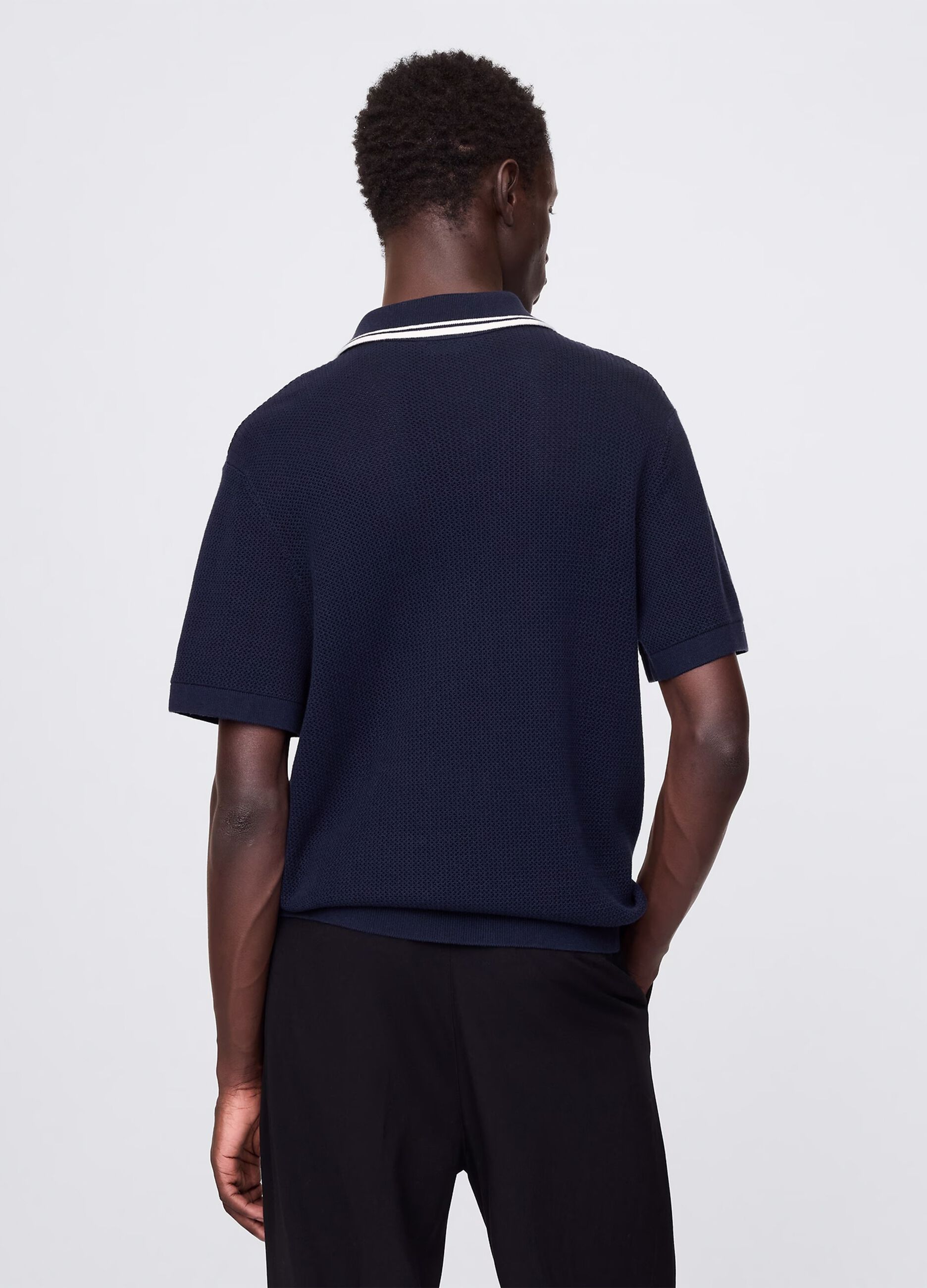 Polo traforata in cotone blu