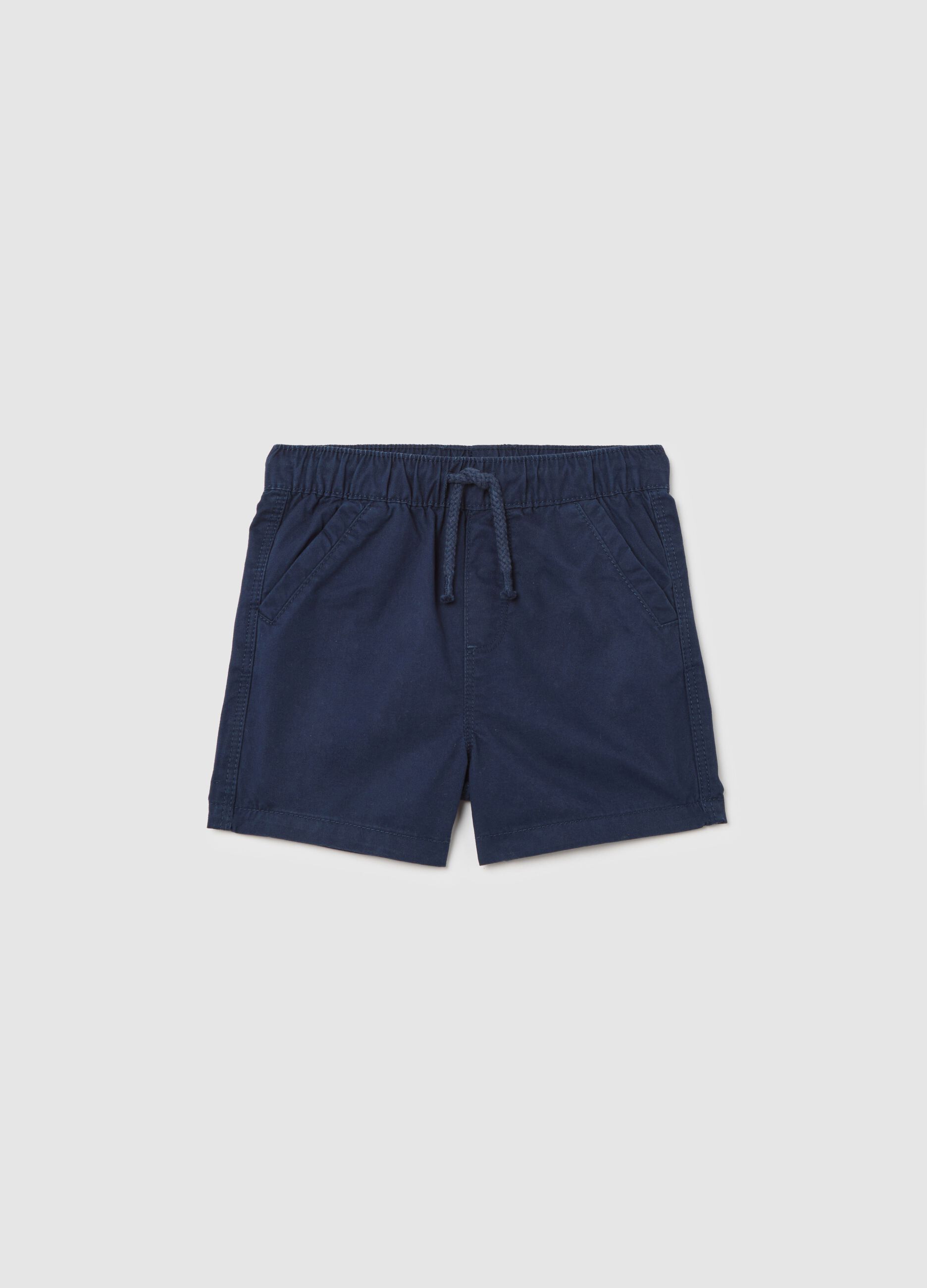 Boys’ shorts in 100% blue cotton with regular fit and elasticated waist