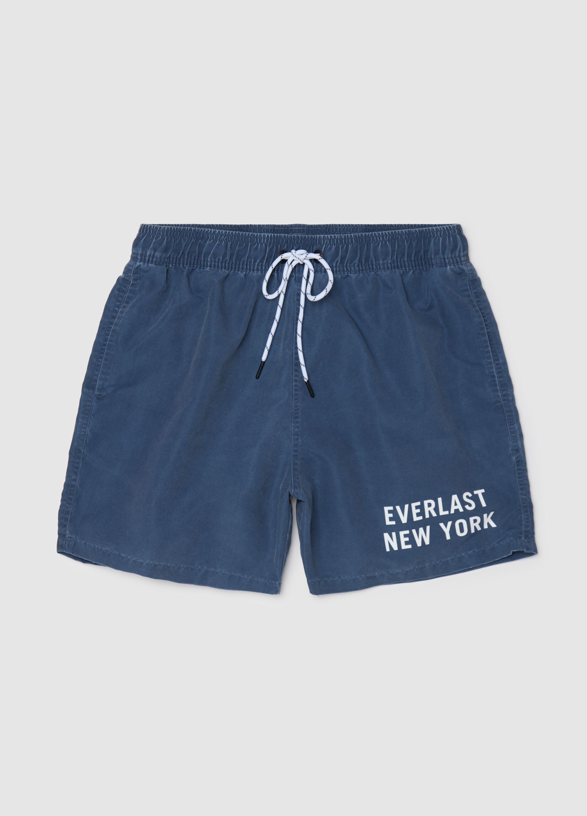 Blue swimming trunks with logo print