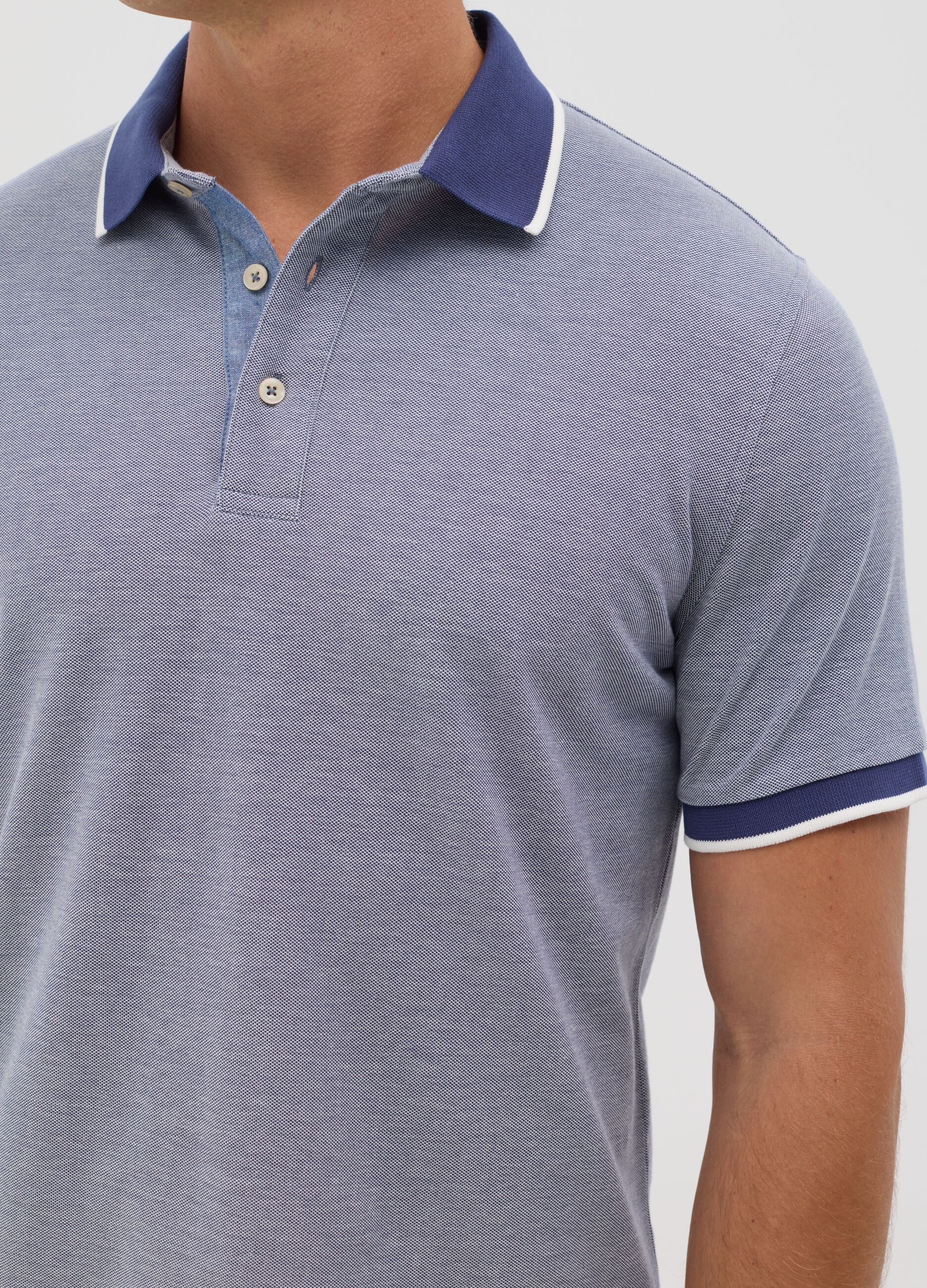 Blue polo shirt with short sleeves in cotton piquet