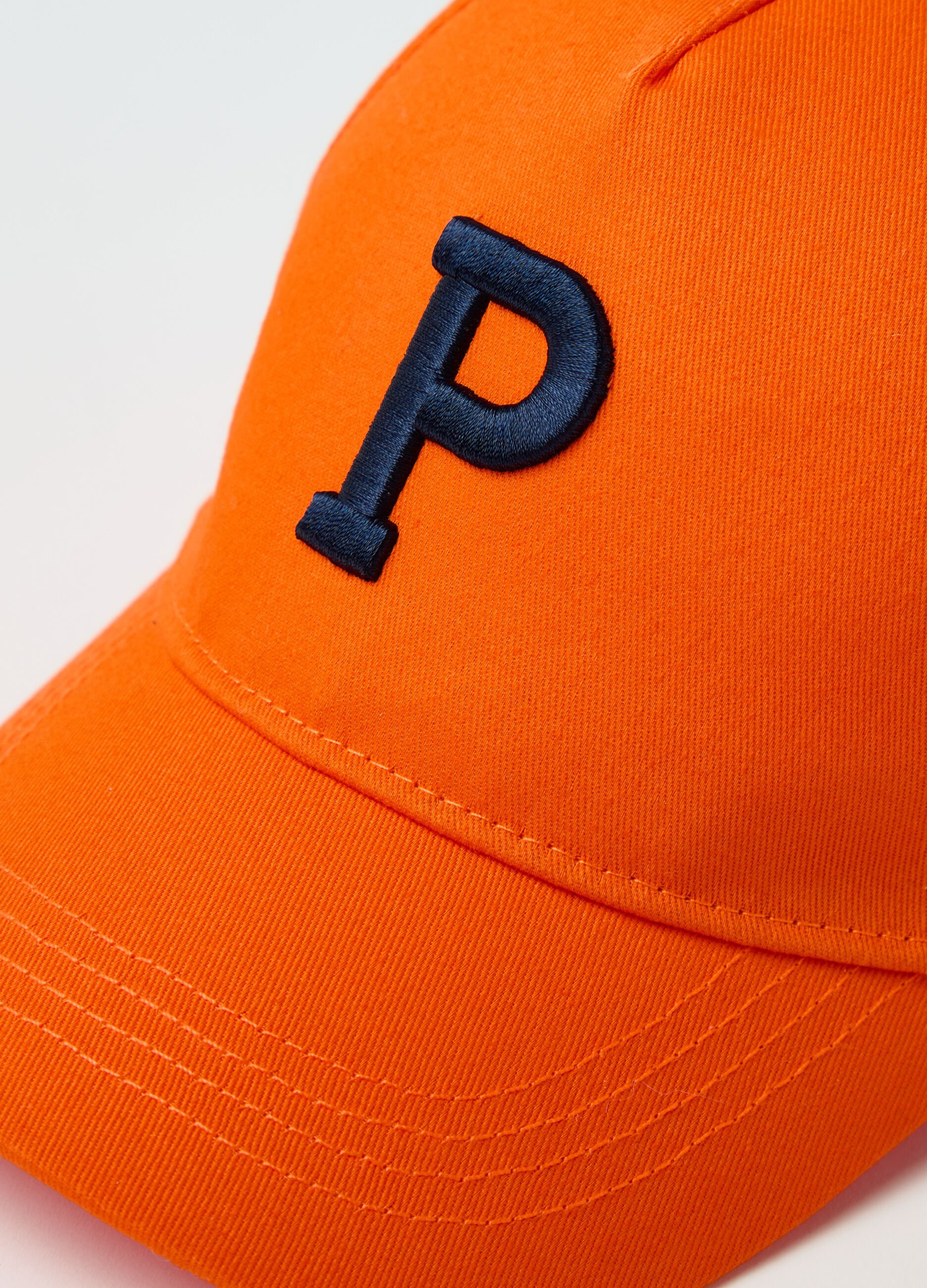 Baseball cap with embroidered logo