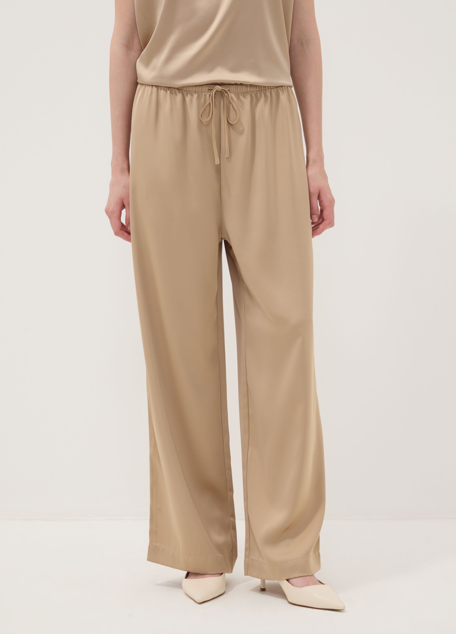 Beige wide-leg trousers with regular waist
