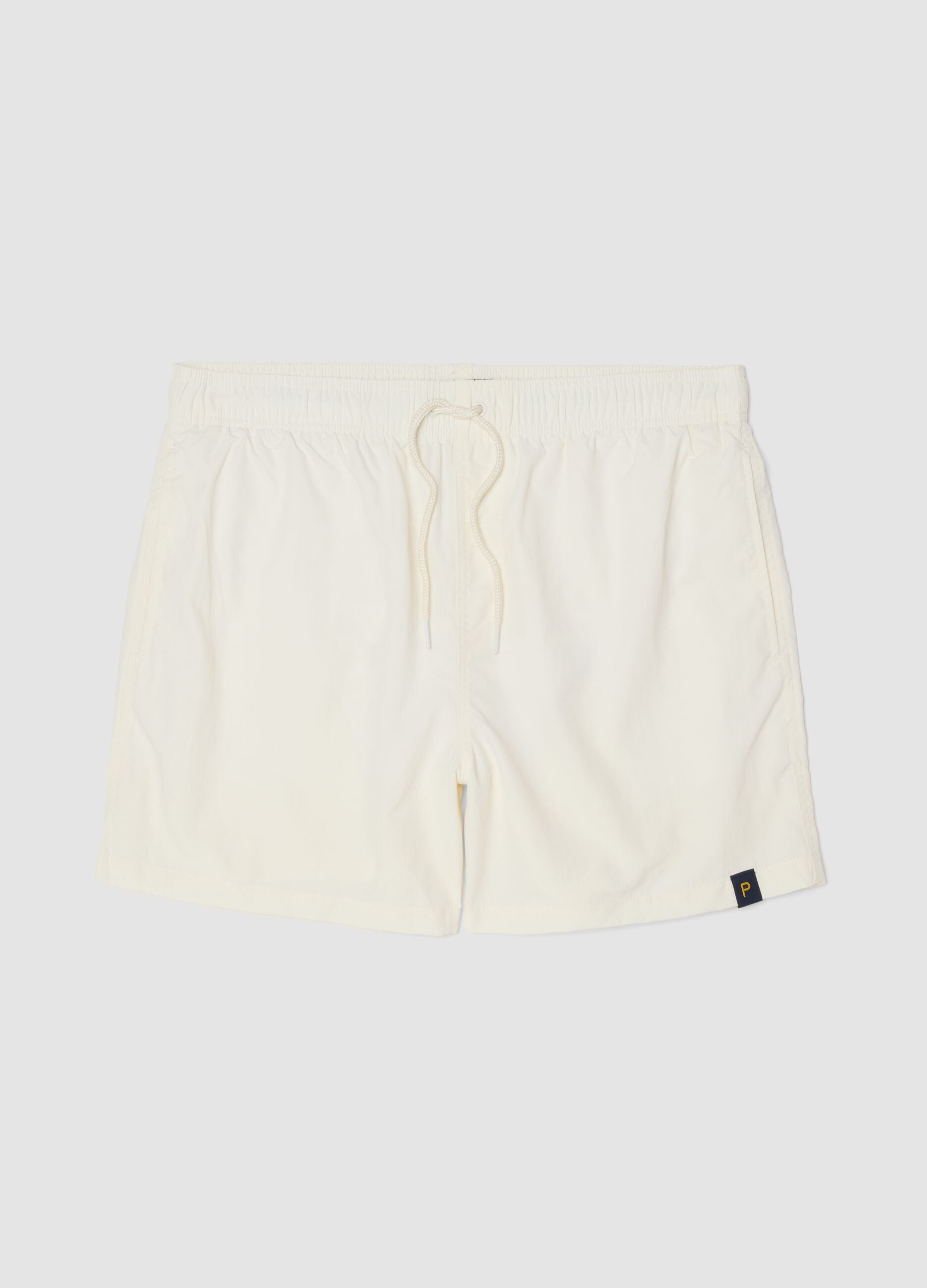 White swim shorts with elasticated waistband and drawstring