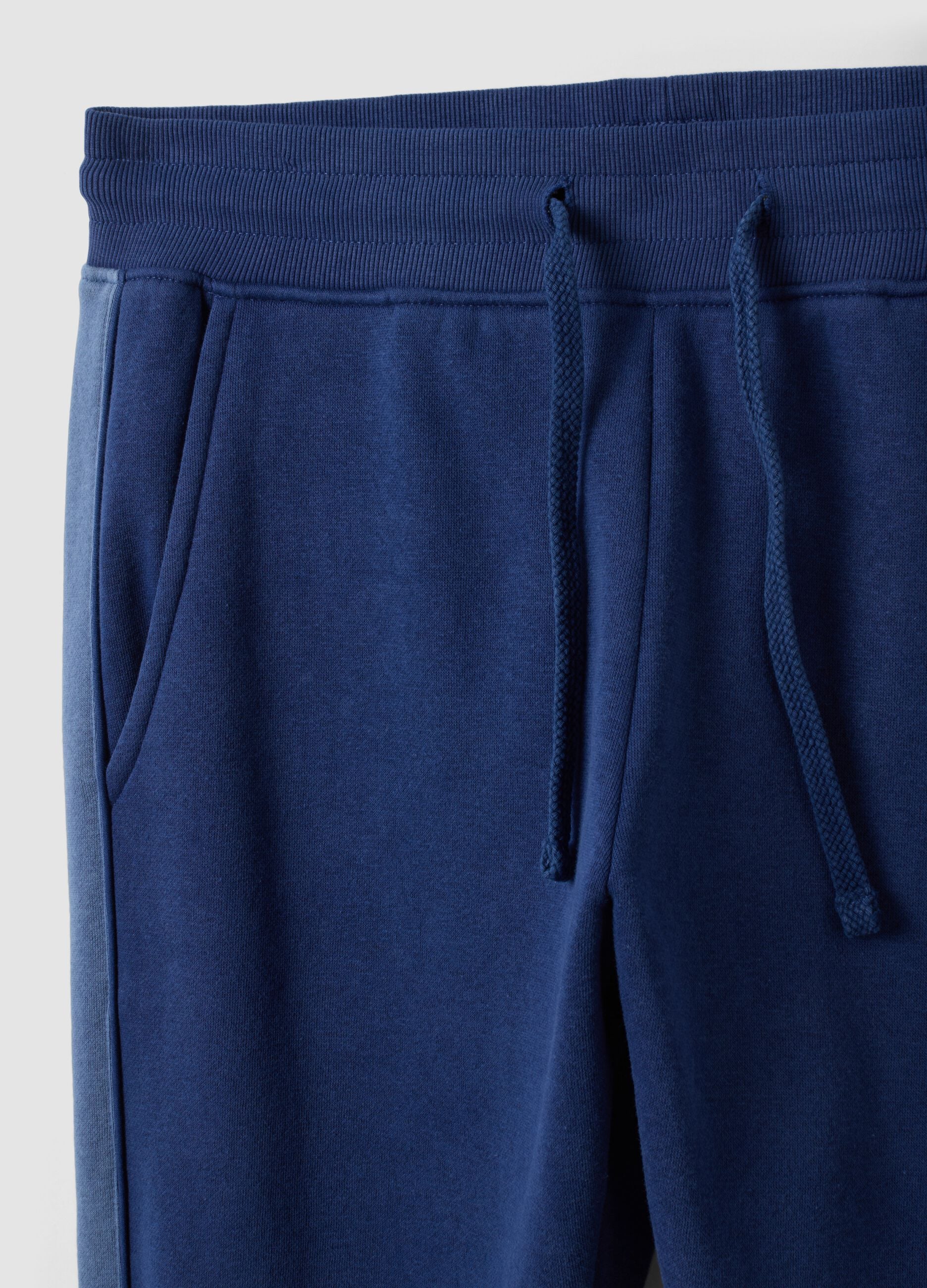Blue cotton-blend joggers with print